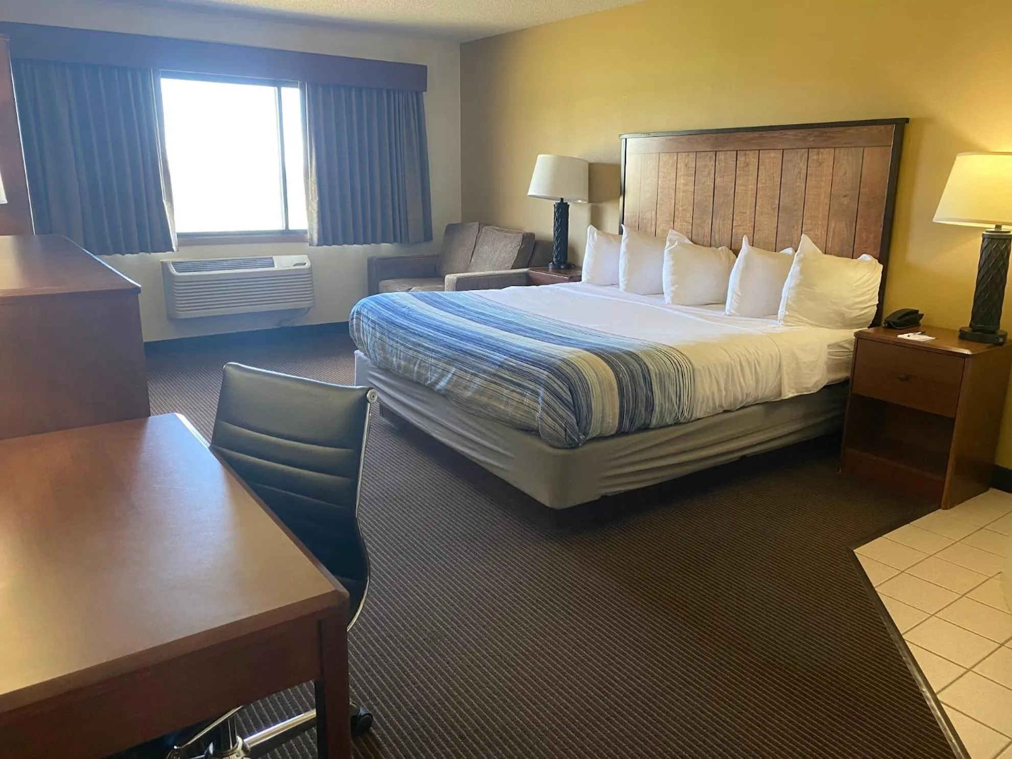 Bed in AmericInn by Wyndham Two Harbors Near Lake Superior