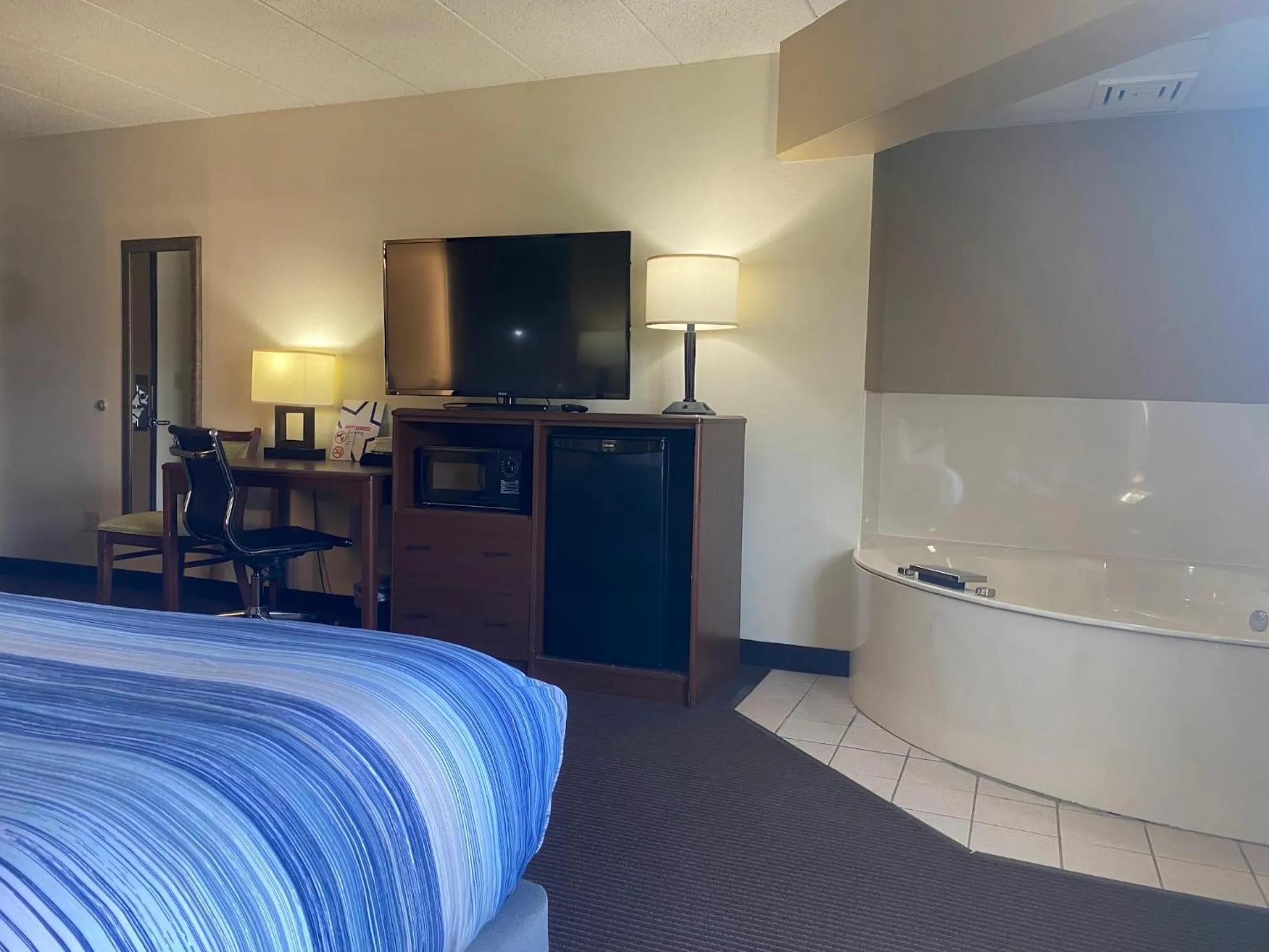 Bed in AmericInn by Wyndham Two Harbors Near Lake Superior