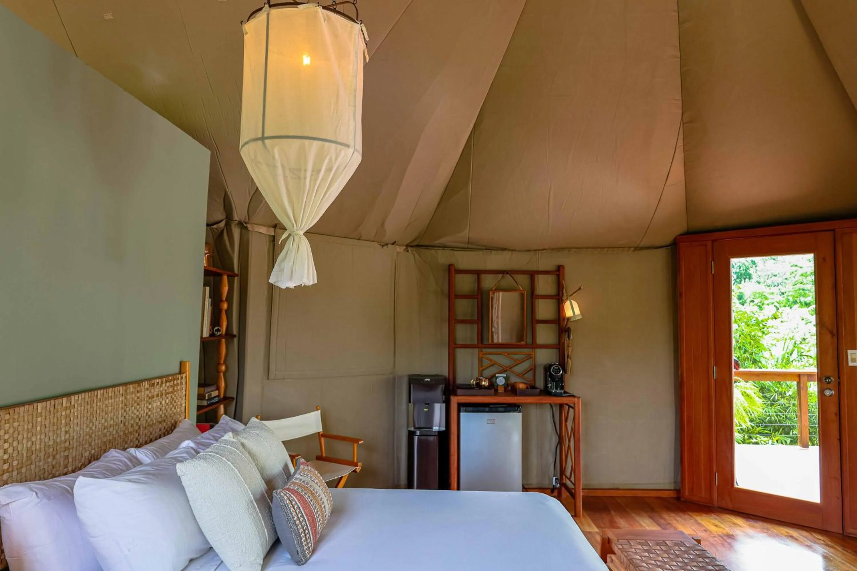 Bed in Sleeping Giant Rainforest Lodge