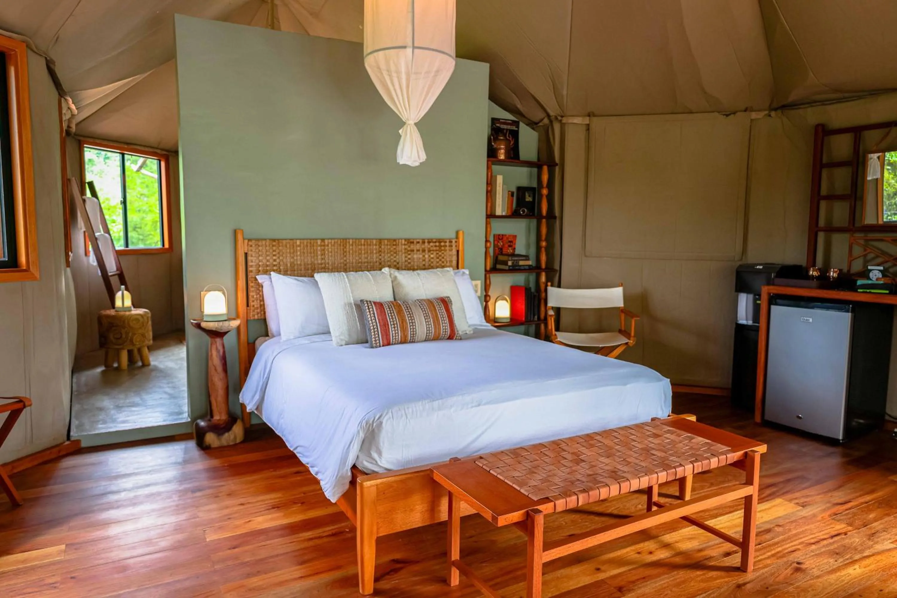 Bed in Sleeping Giant Rainforest Lodge