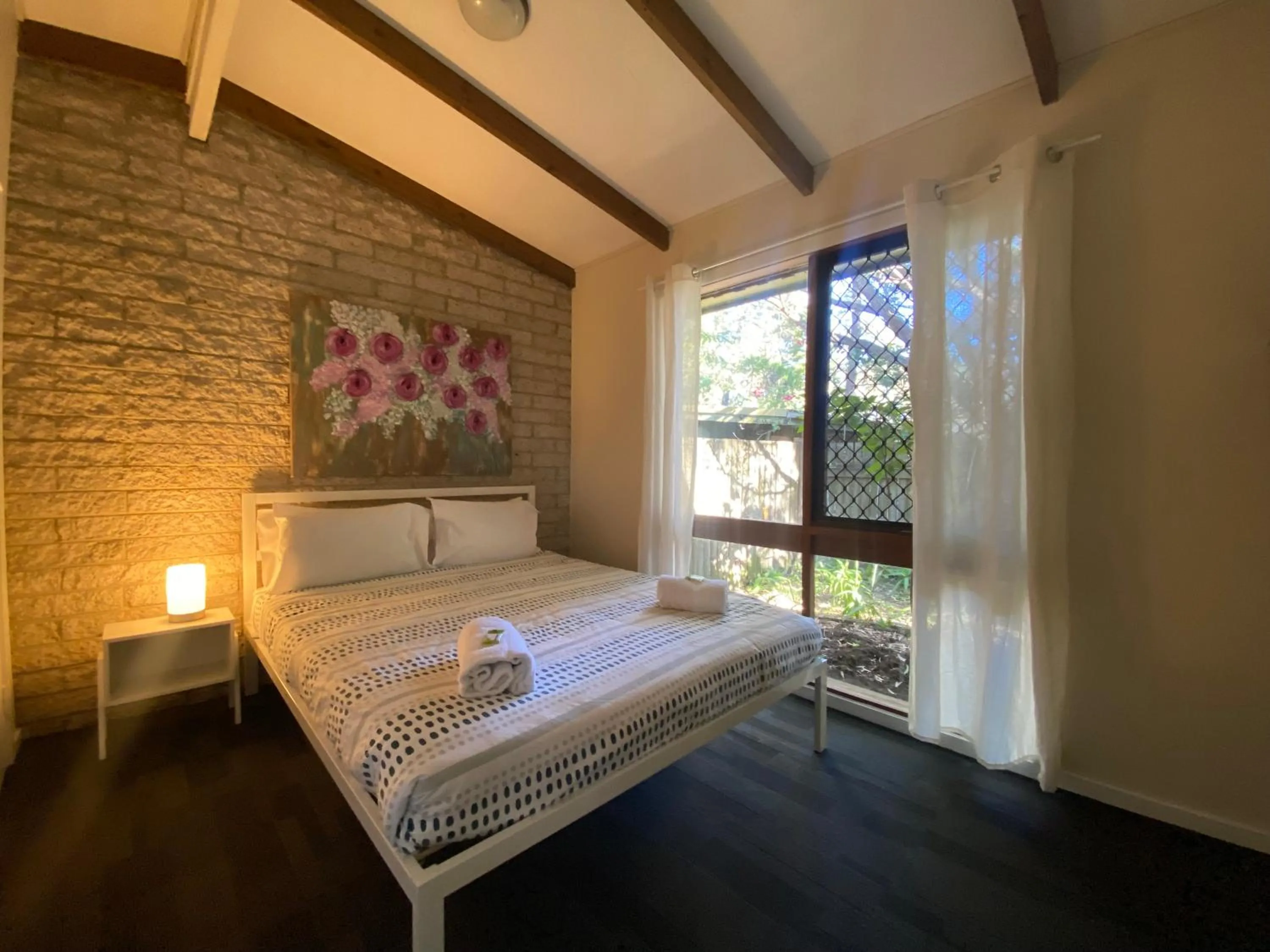 Bed in Colonial Village Resort