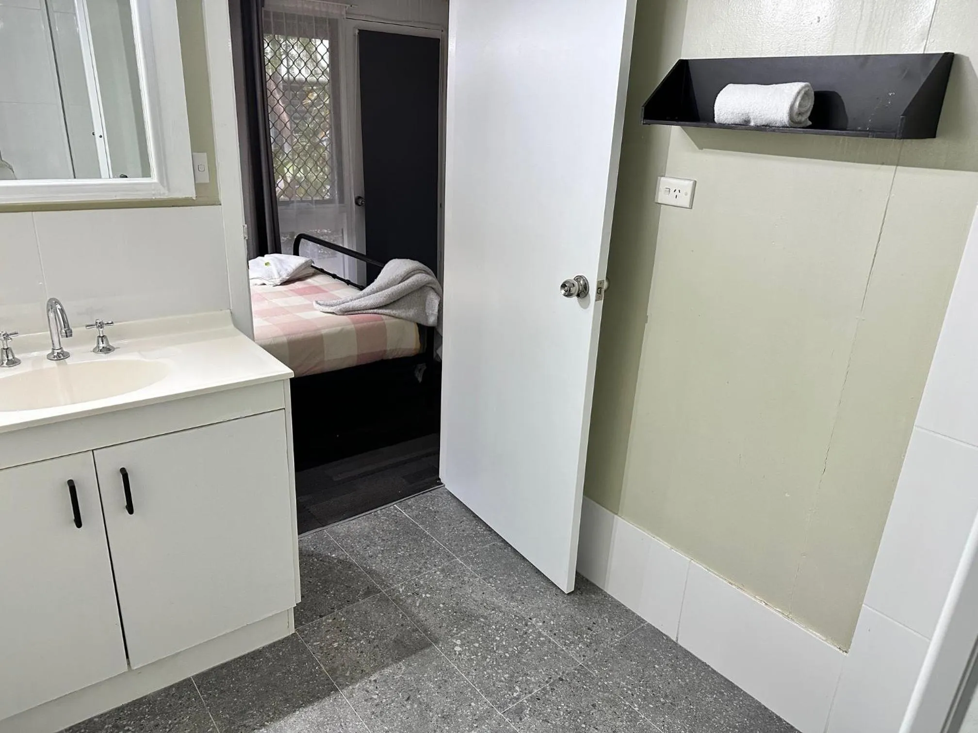 Bed in Colonial Village Resort