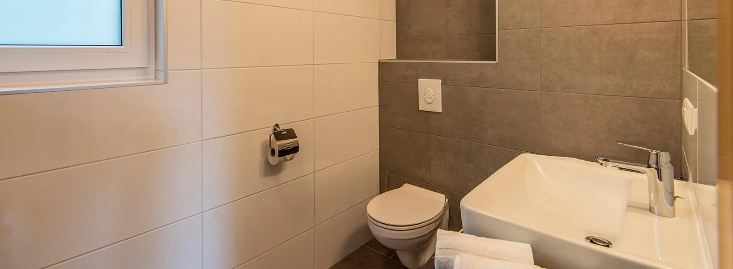 Bathroom in Apartment Dorf Wagrain Alpenleben by AlpenTravel