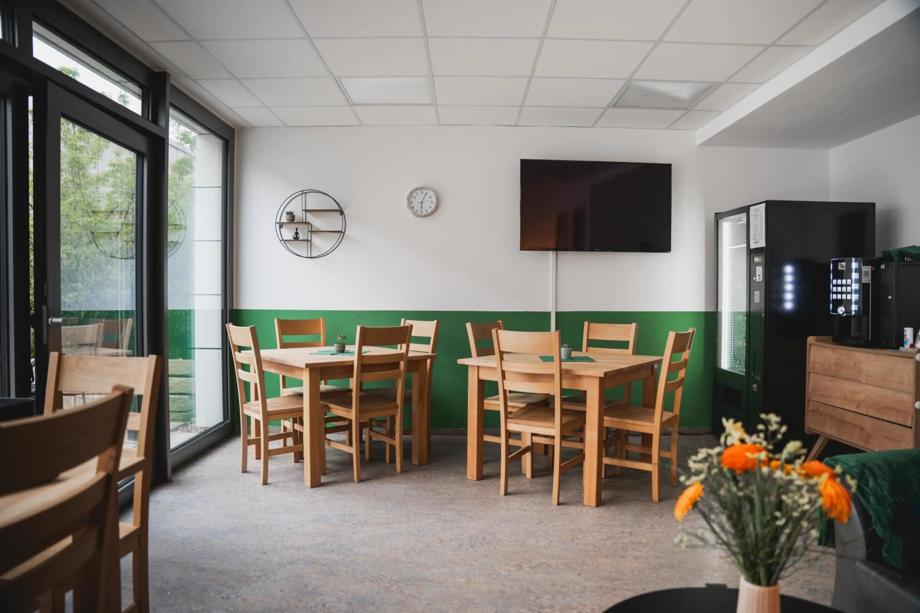 Communal lounge/ TV room in Hotel Garni Fischerfleck in Ismaning near Munich