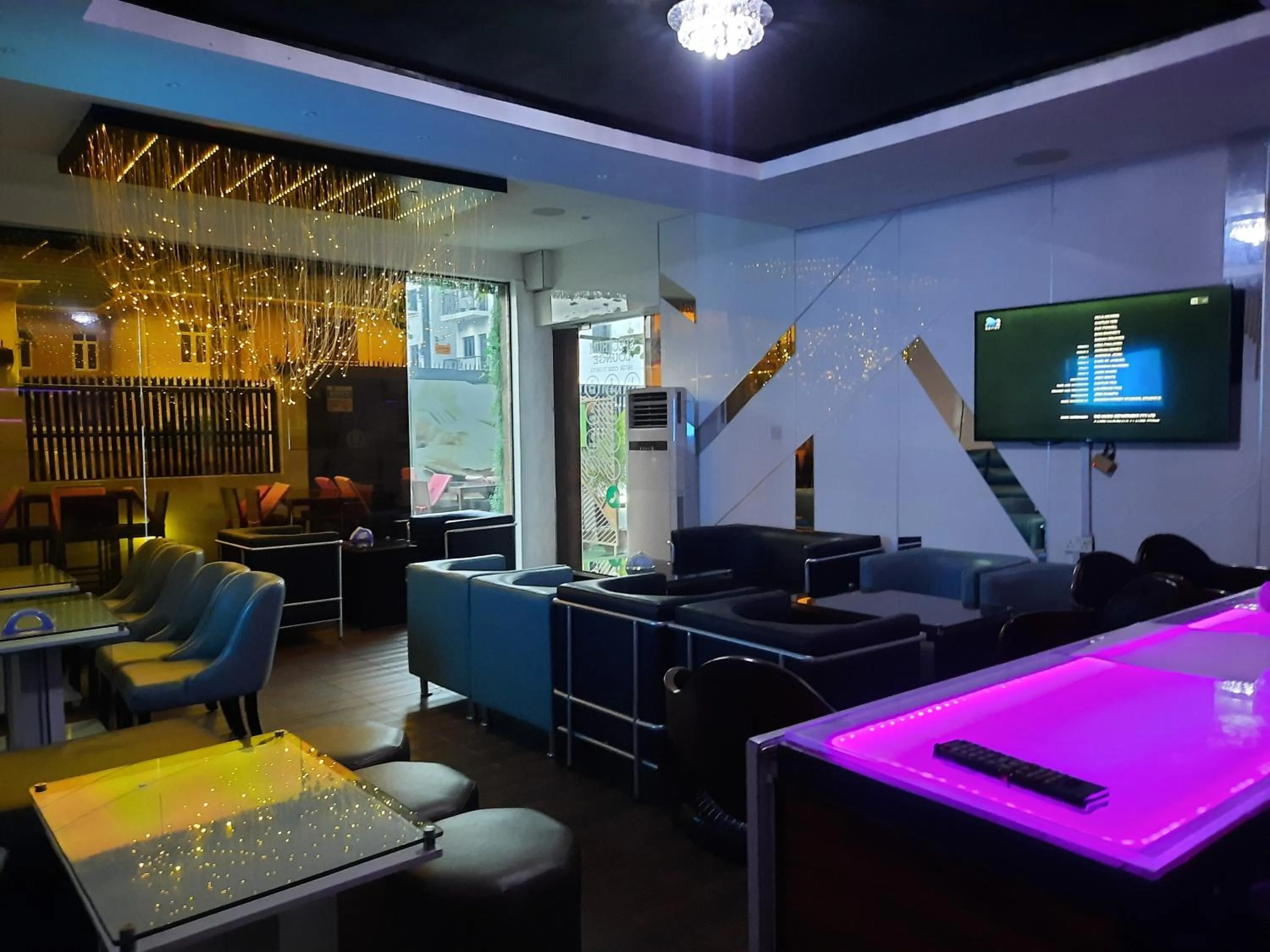 Communal lounge/ TV room in James Court Hotel & Luxury Apartments