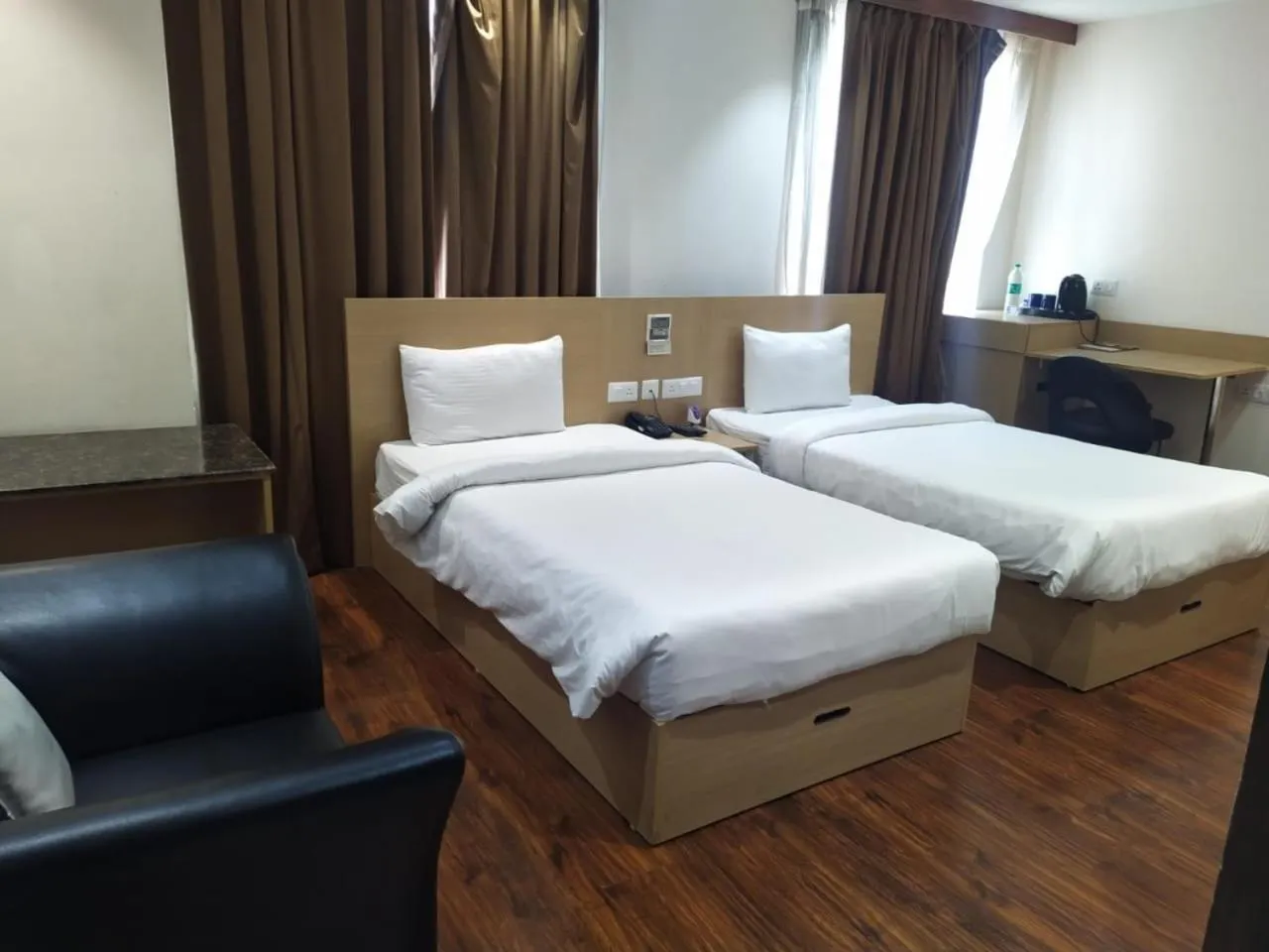 Bed in Hyphen Business Hotel