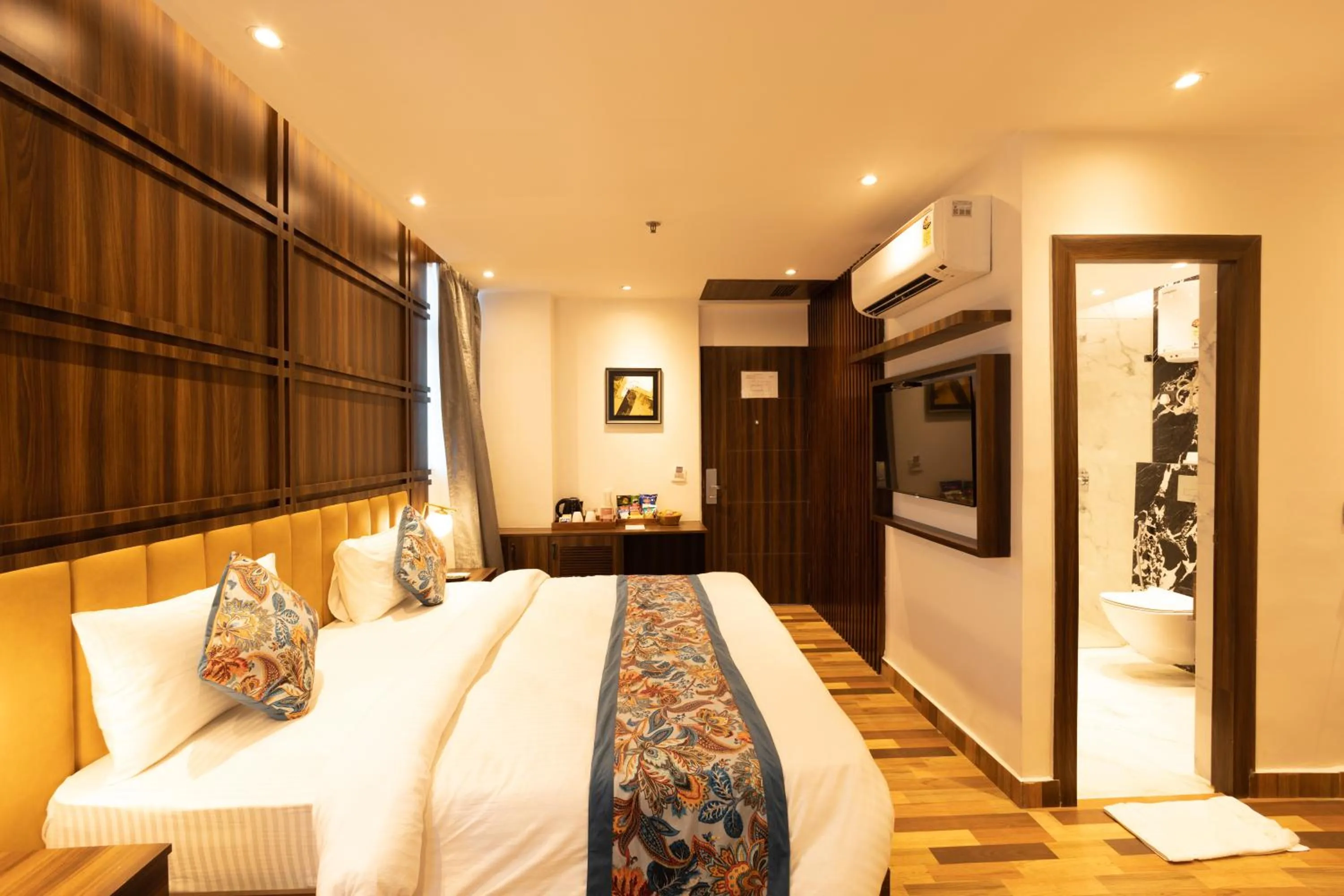 Bed in Hyphen Business Hotel