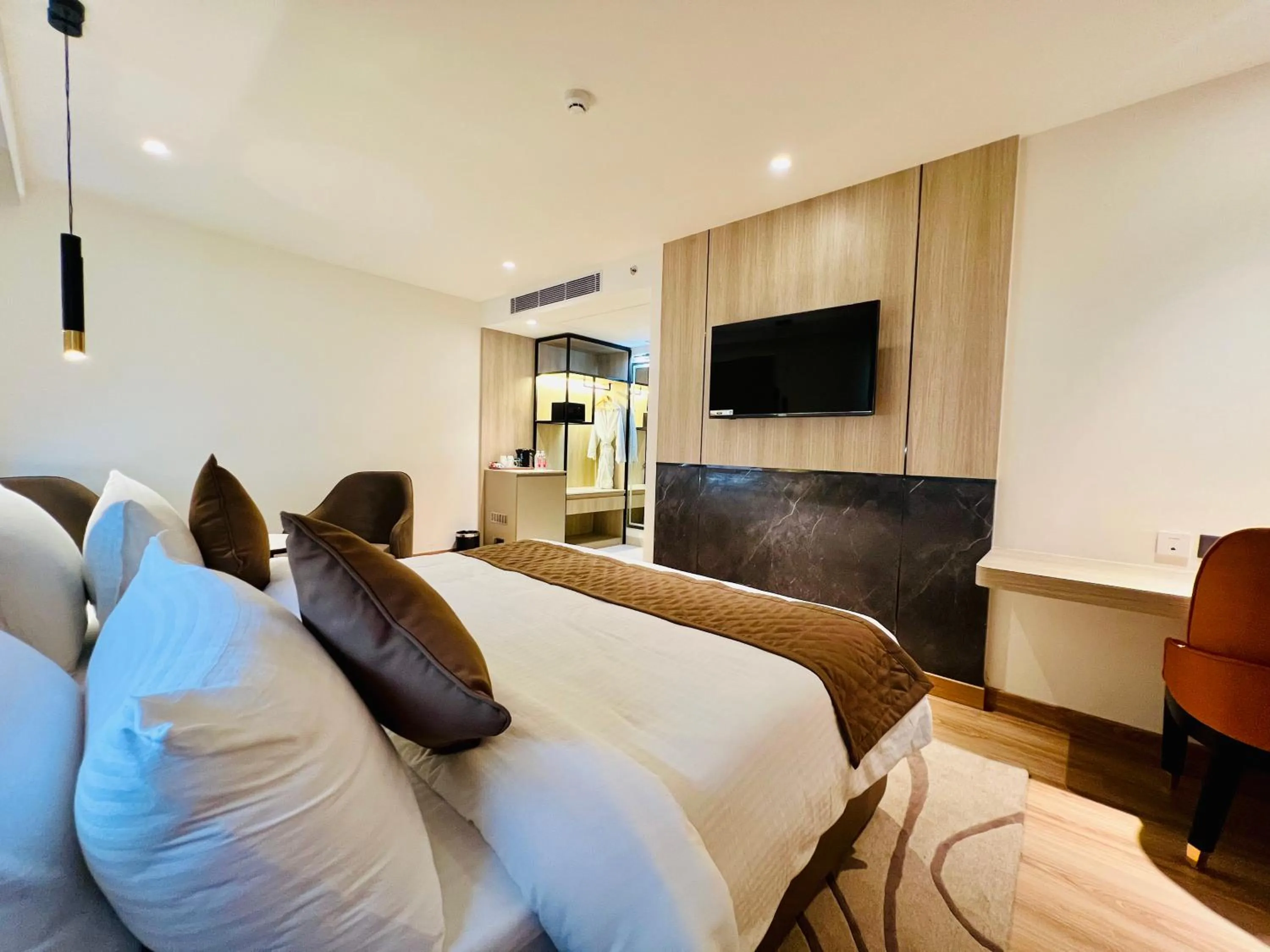 Bedroom in Hyphen Business Hotel