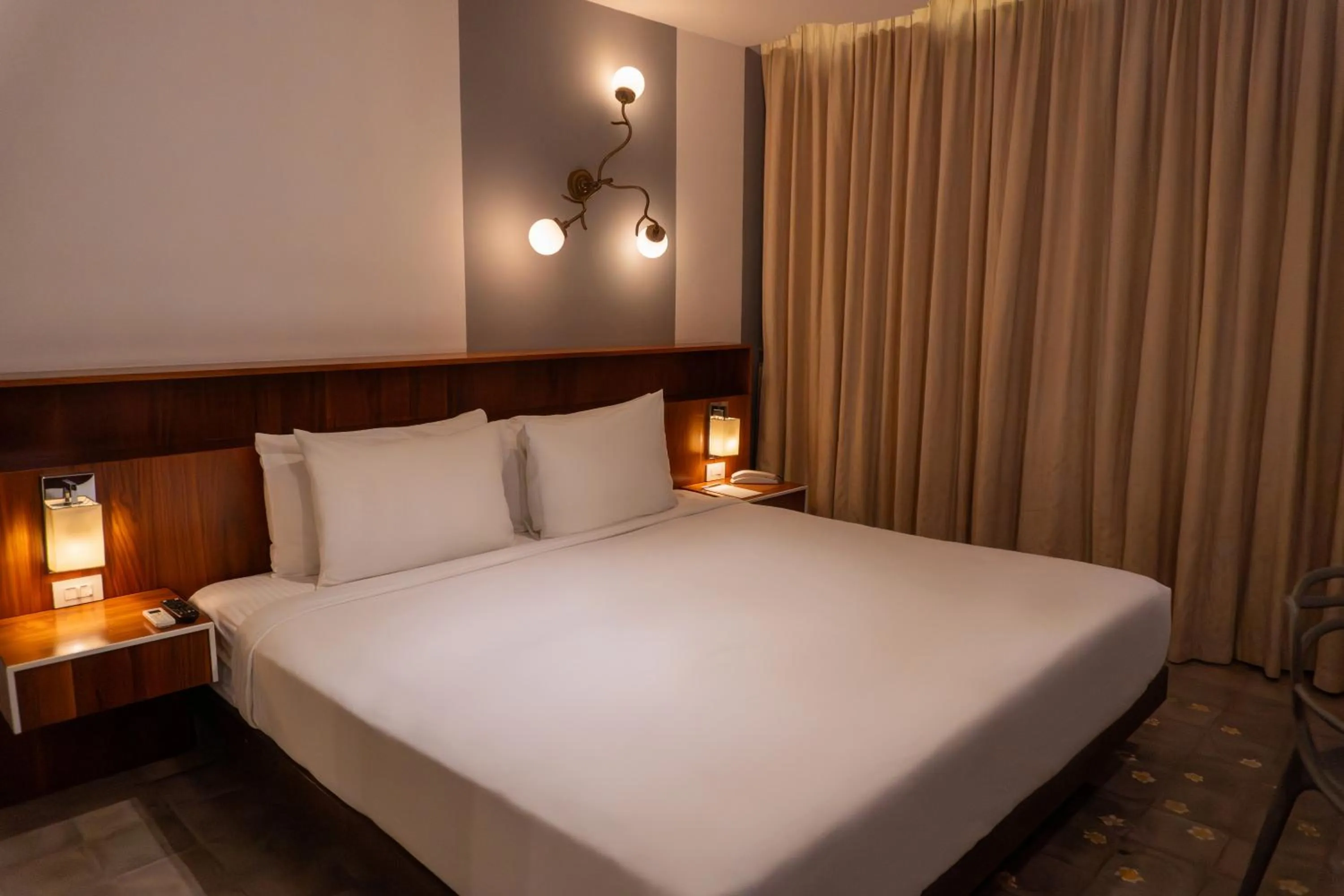 Bed in Flor de Mayo Hotel & Restaurant