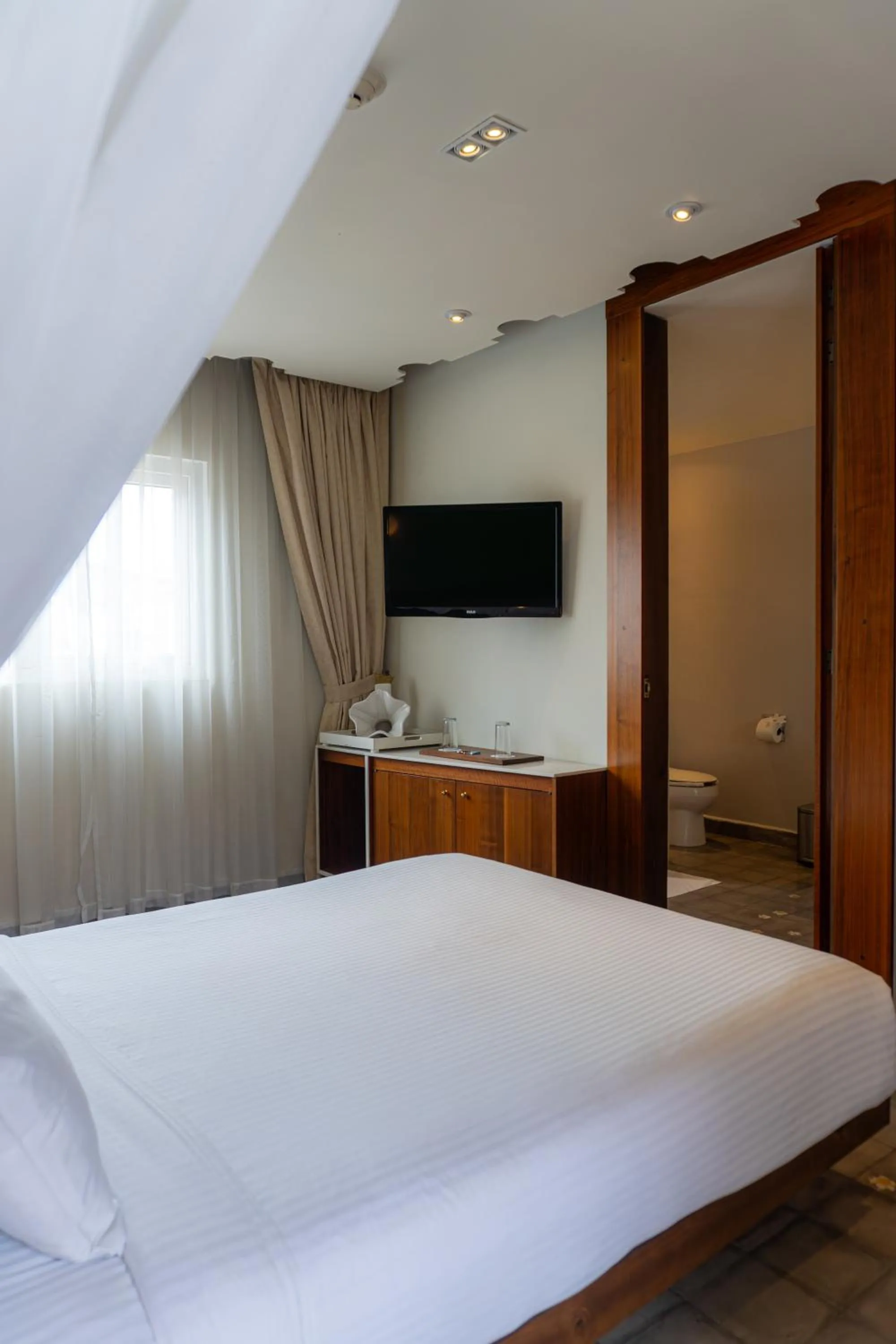 Bed in Flor de Mayo Hotel & Restaurant