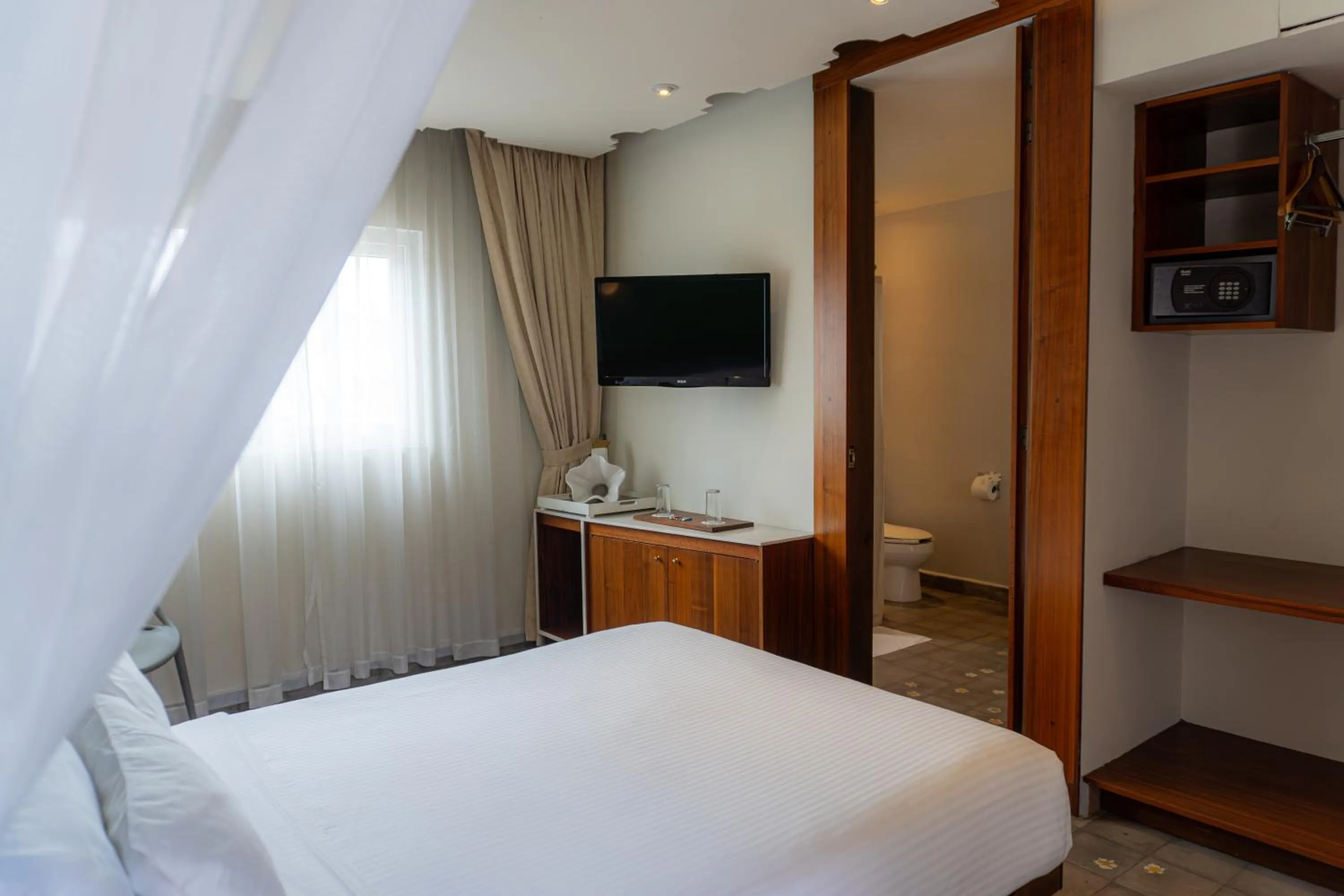 Bed in Flor de Mayo Hotel & Restaurant