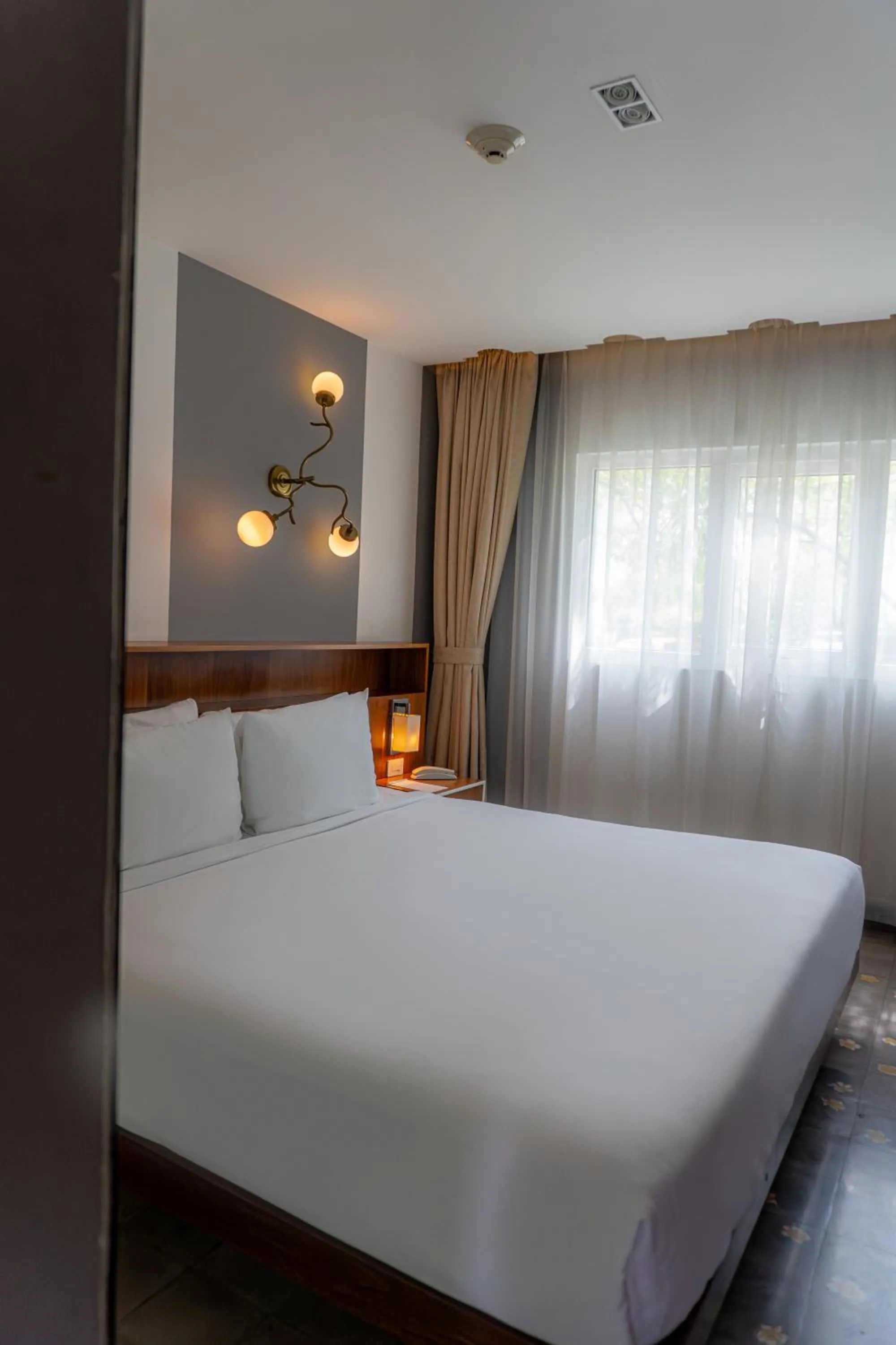 Bed in Flor de Mayo Hotel & Restaurant