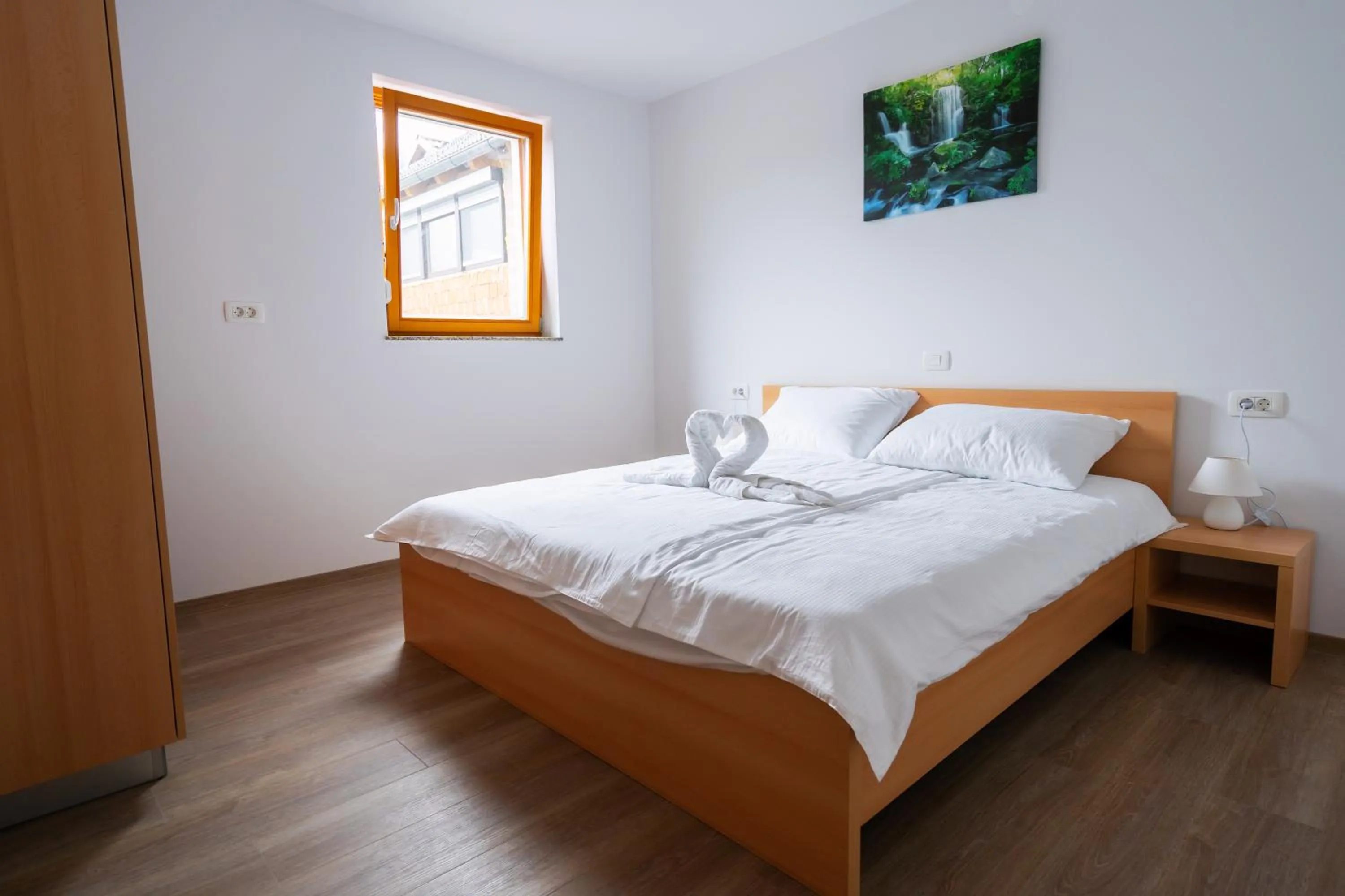 Bed in PJagodic Apartments & Wellness