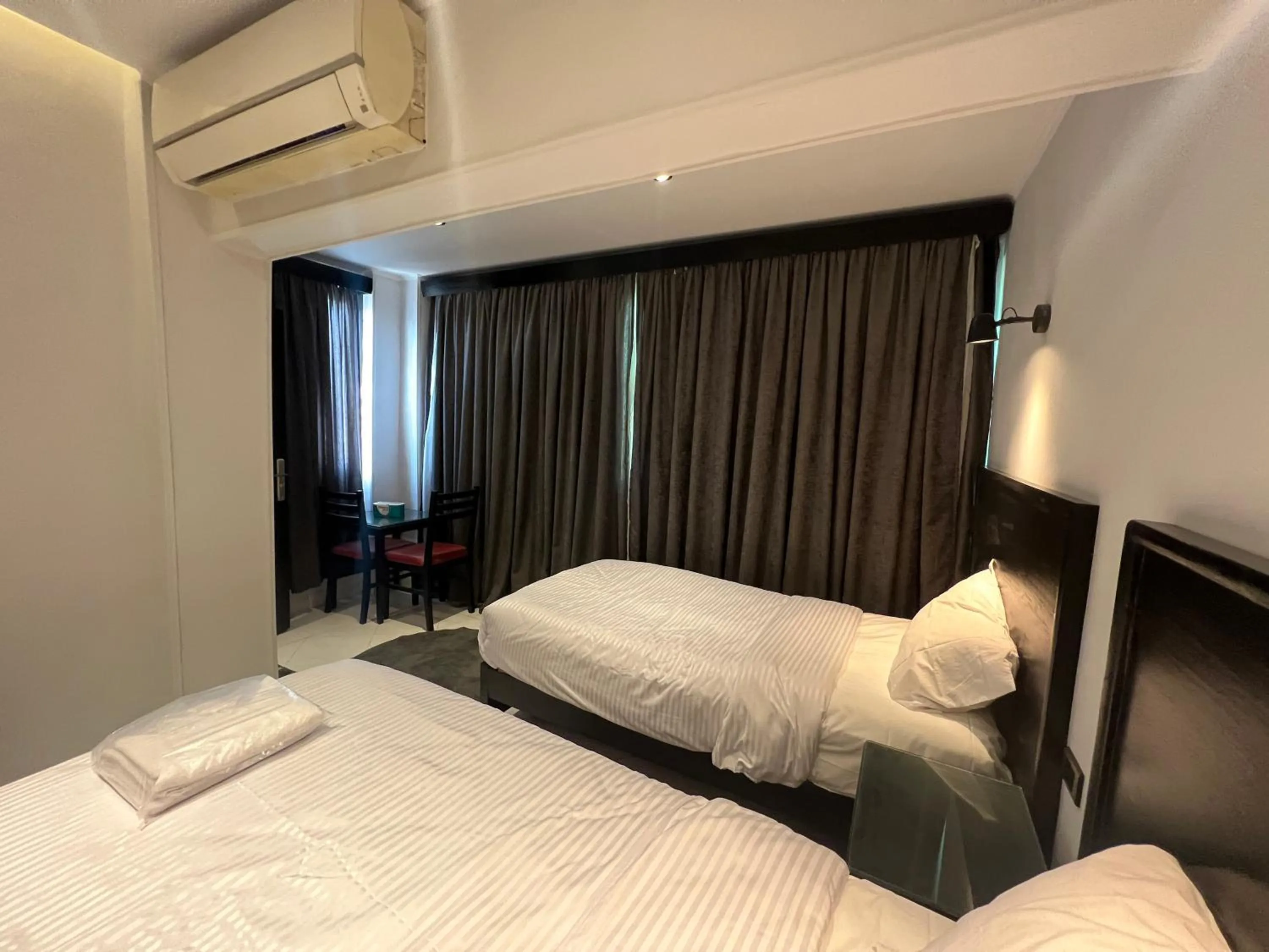 Bed in Helio Cairo Hotel