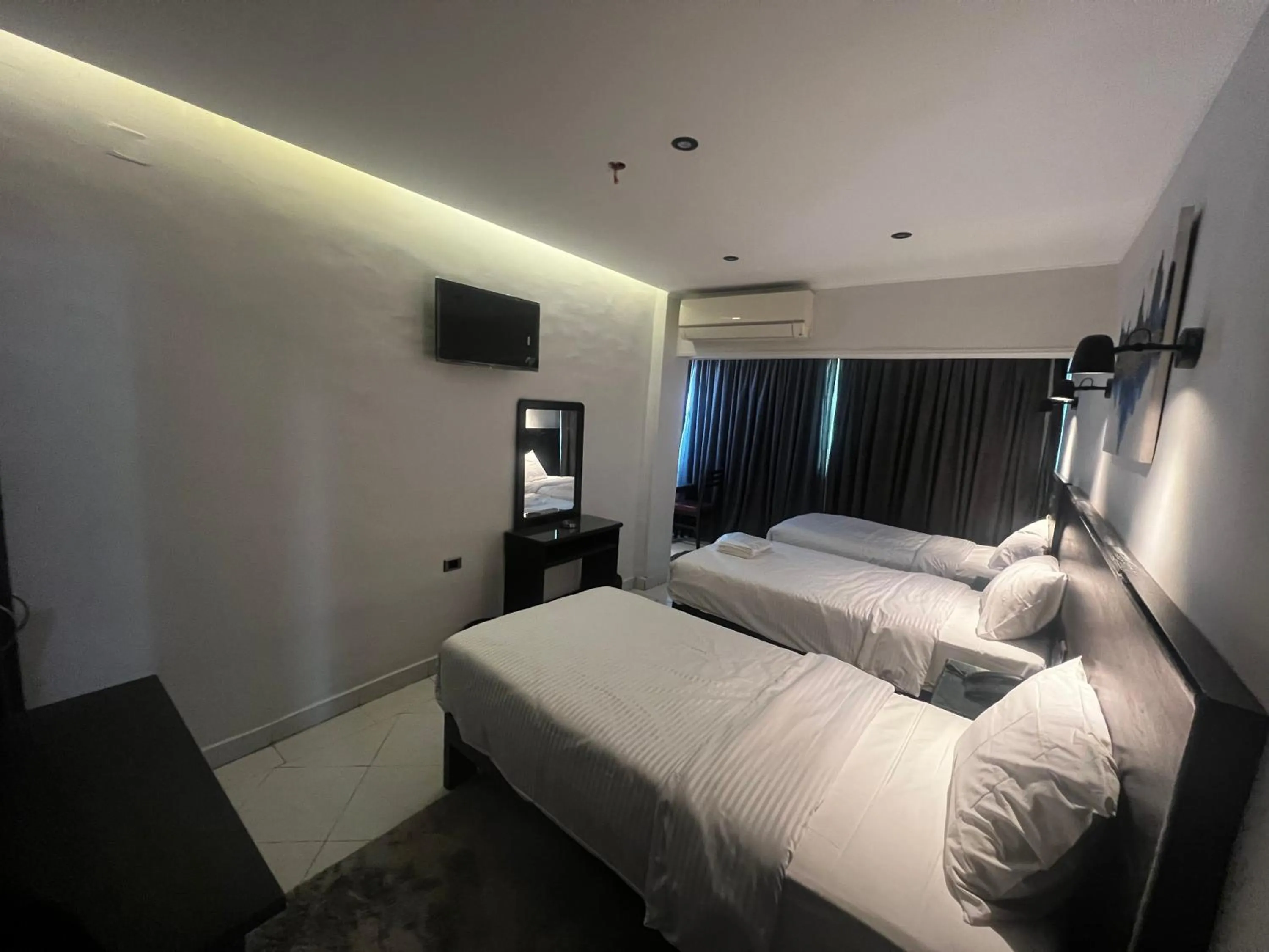 Bed in Helio Cairo Hotel