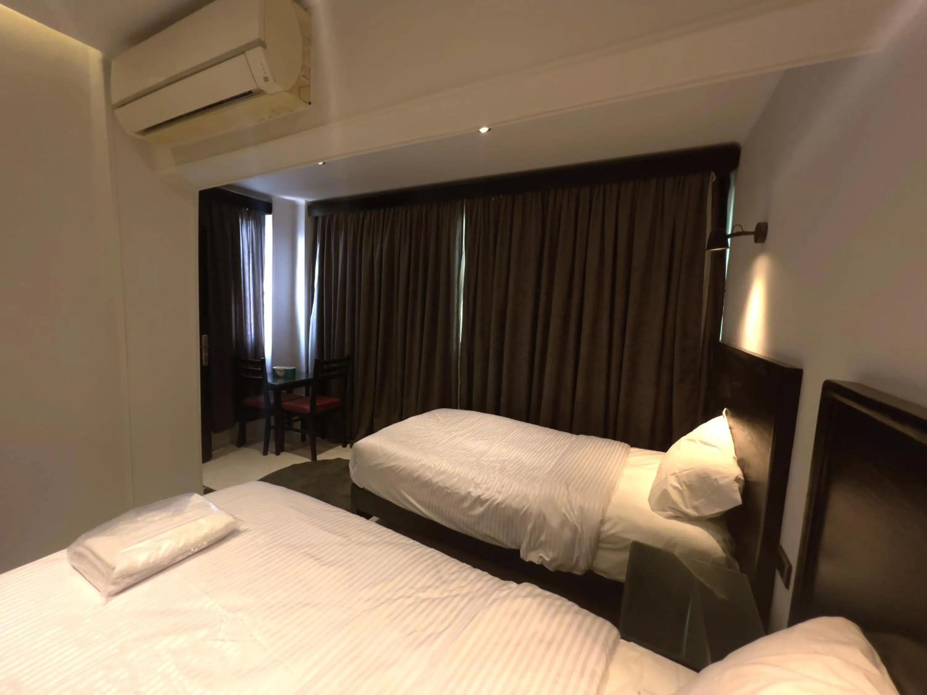 Bed in Helio Cairo Hotel