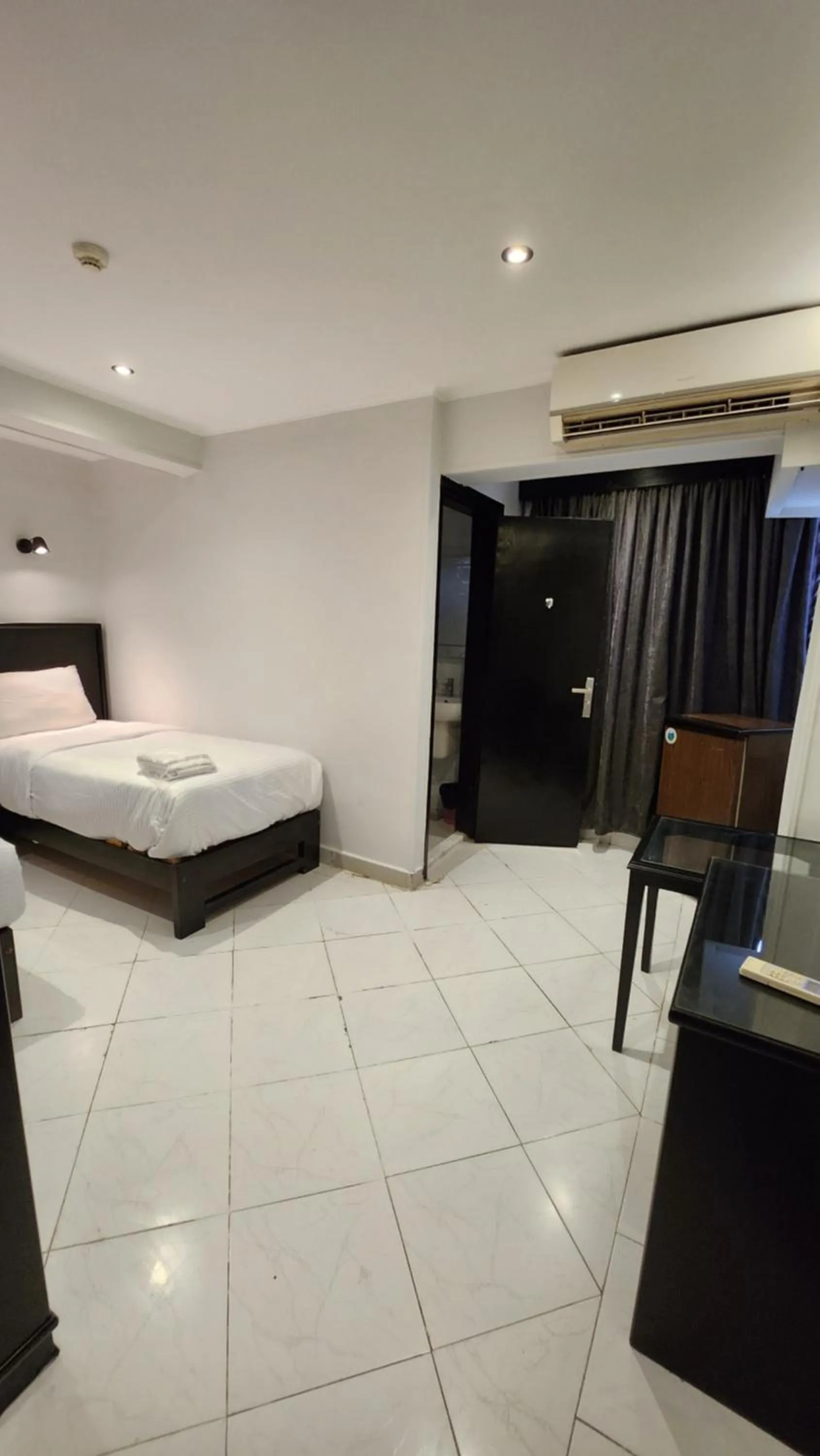 Bed in Helio Cairo Hotel