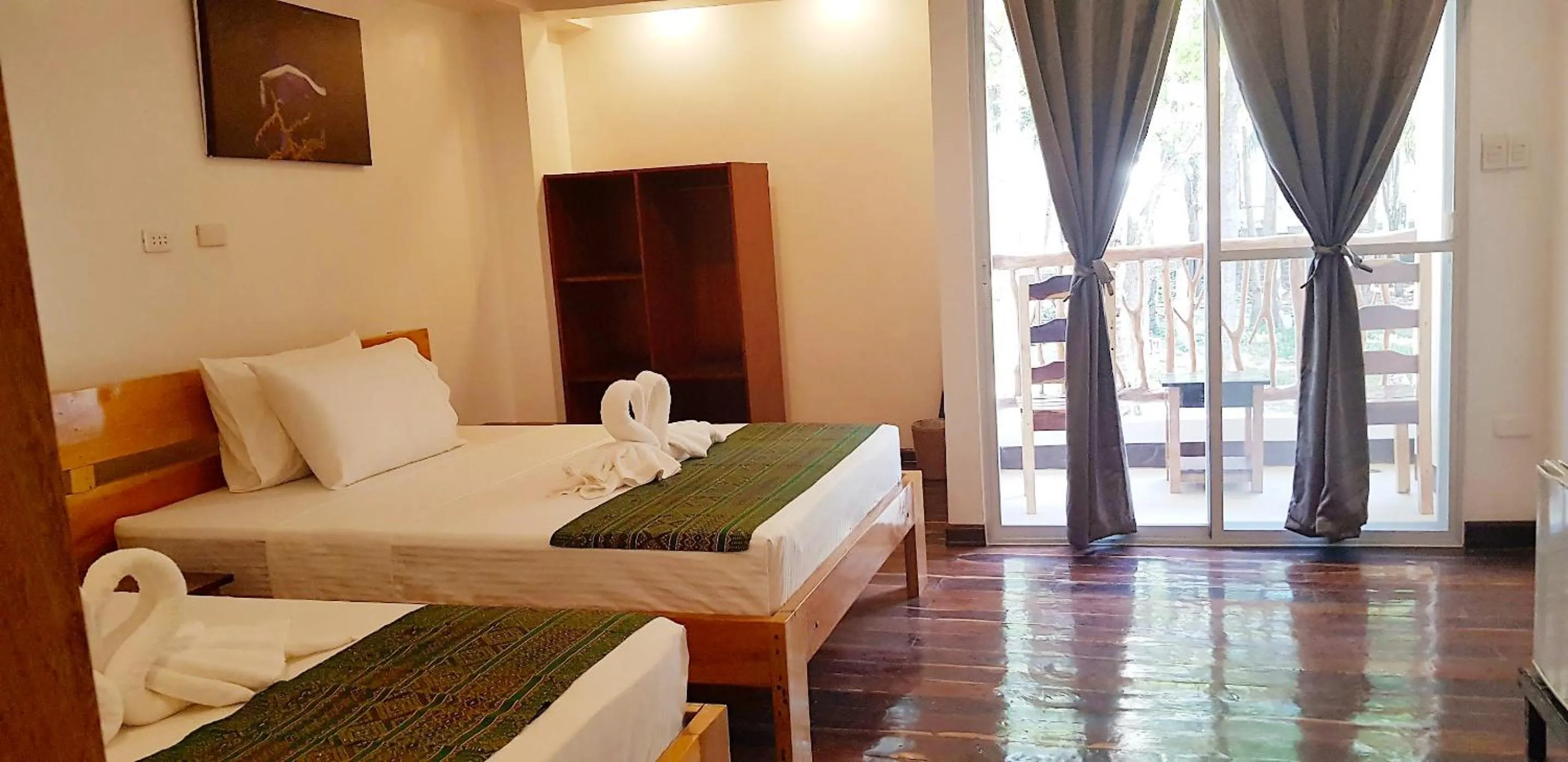 Bed in DiveGurus Boracay Beach Resort