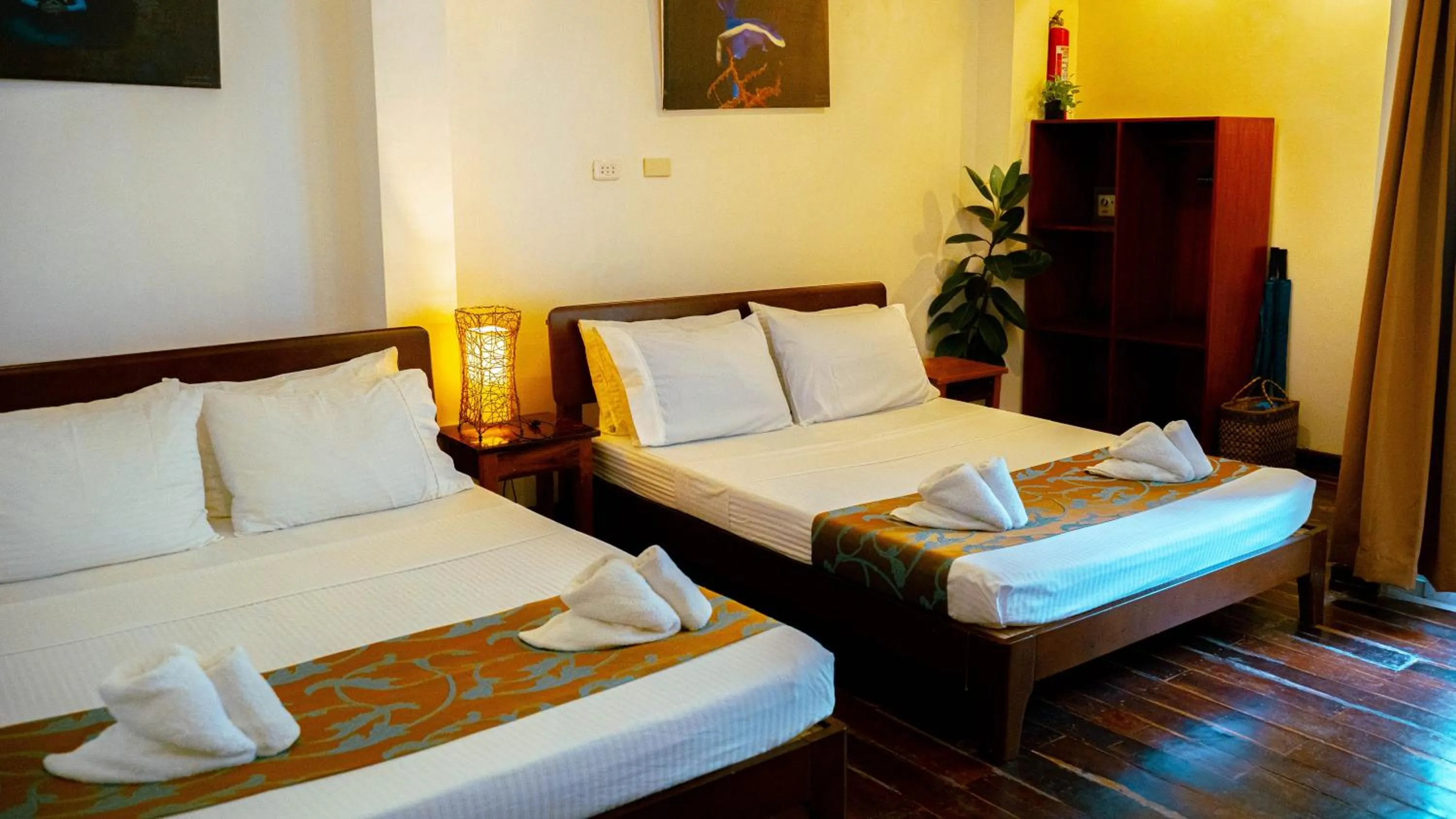 Bed in DiveGurus Boracay Beach Resort