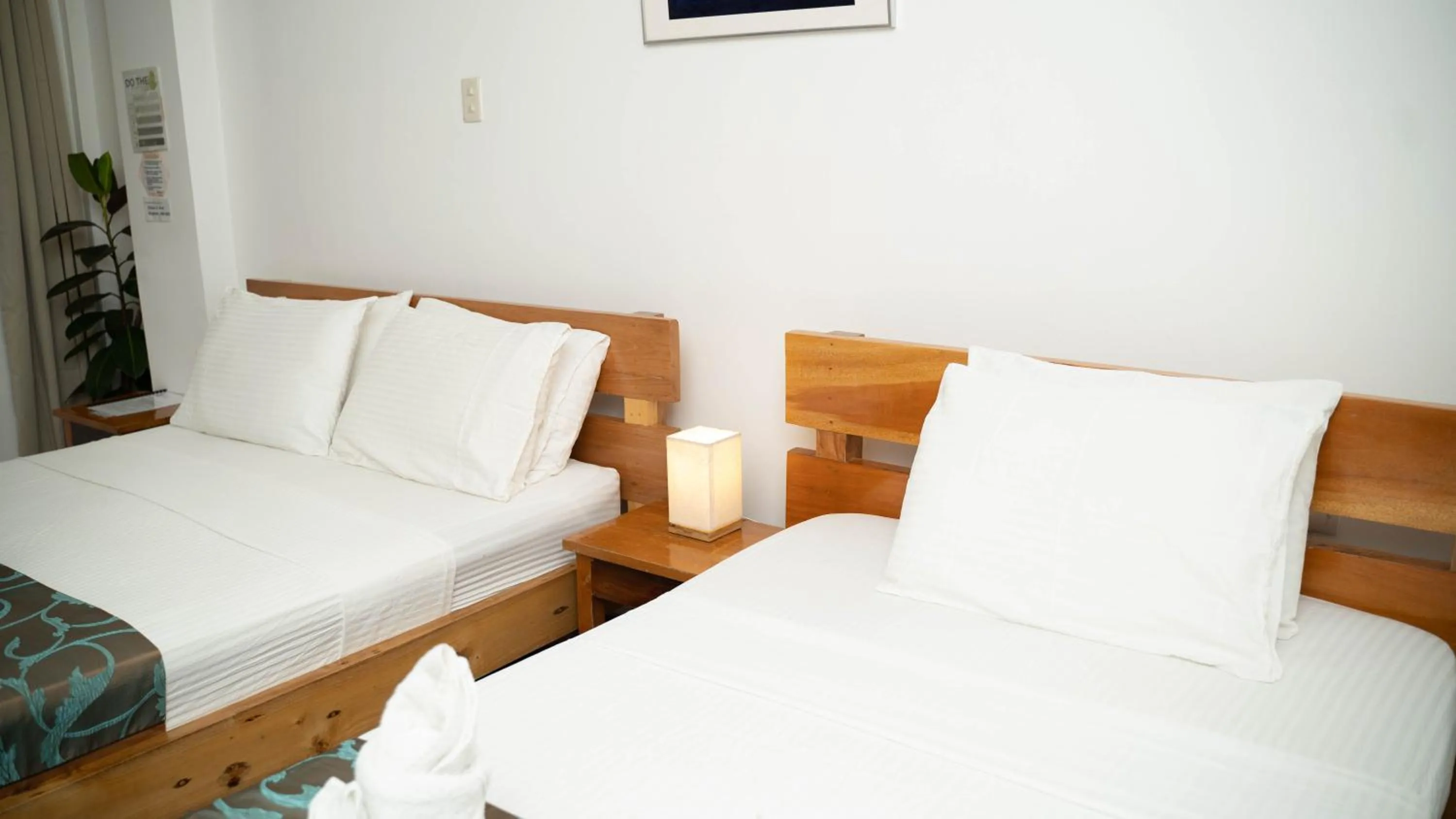 Bed in DiveGurus Boracay Beach Resort