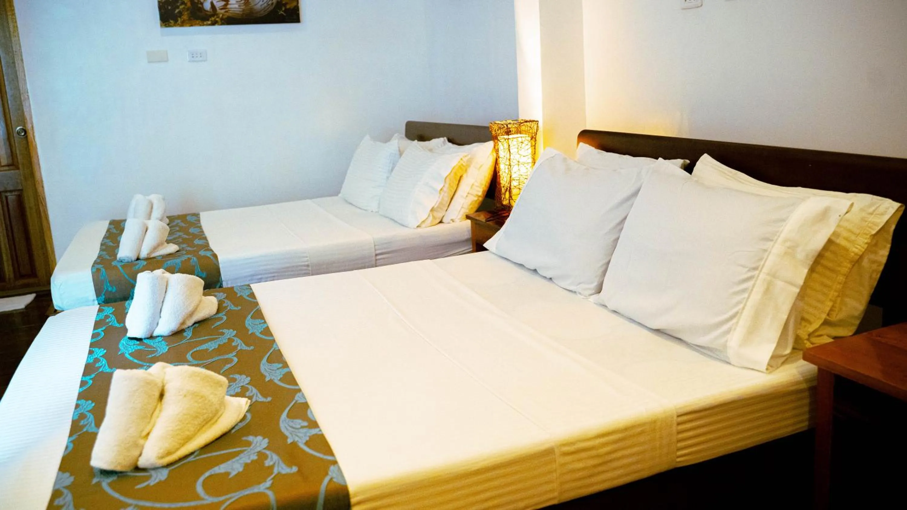 Bed in DiveGurus Boracay Beach Resort