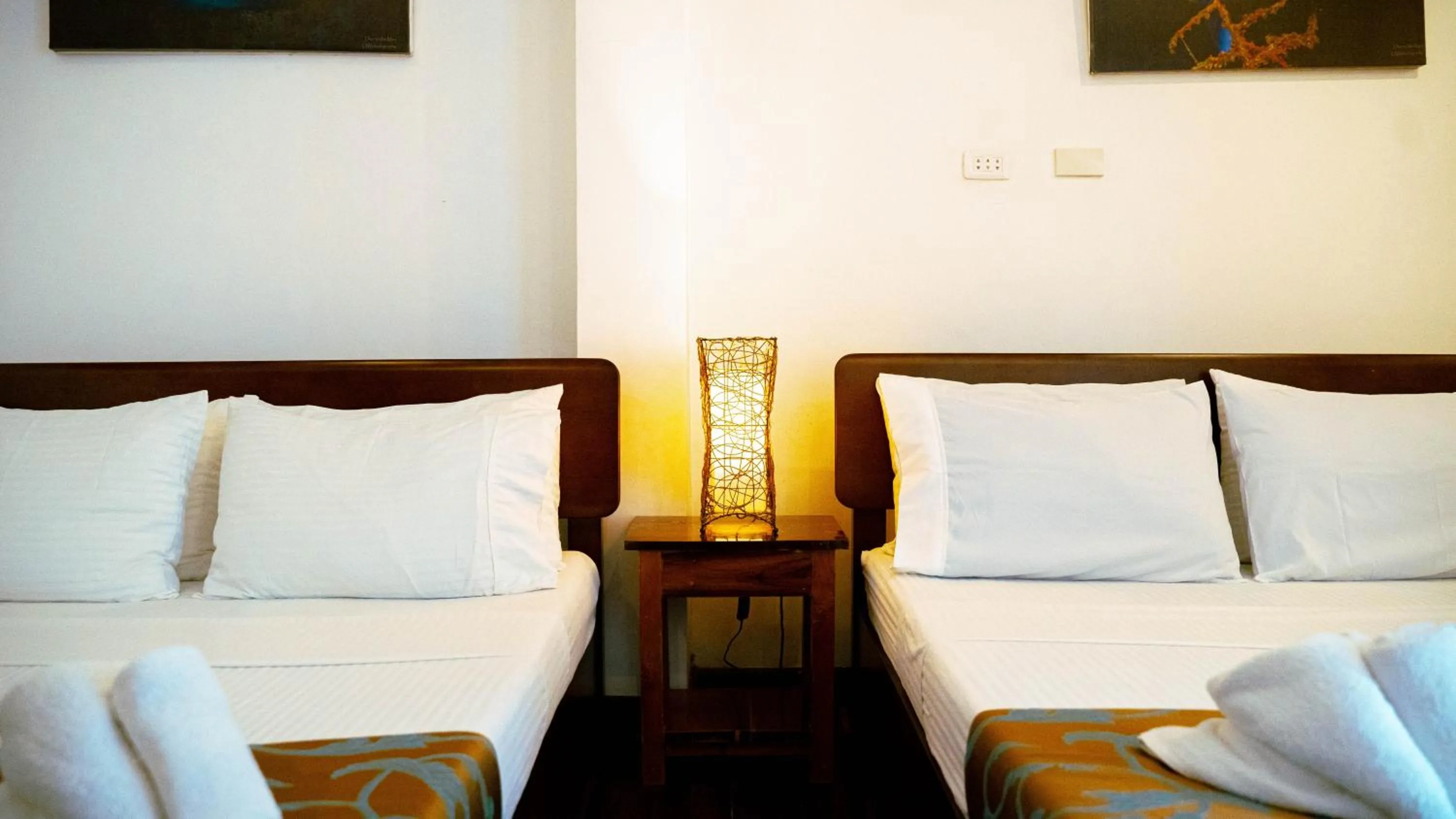 Bed in DiveGurus Boracay Beach Resort