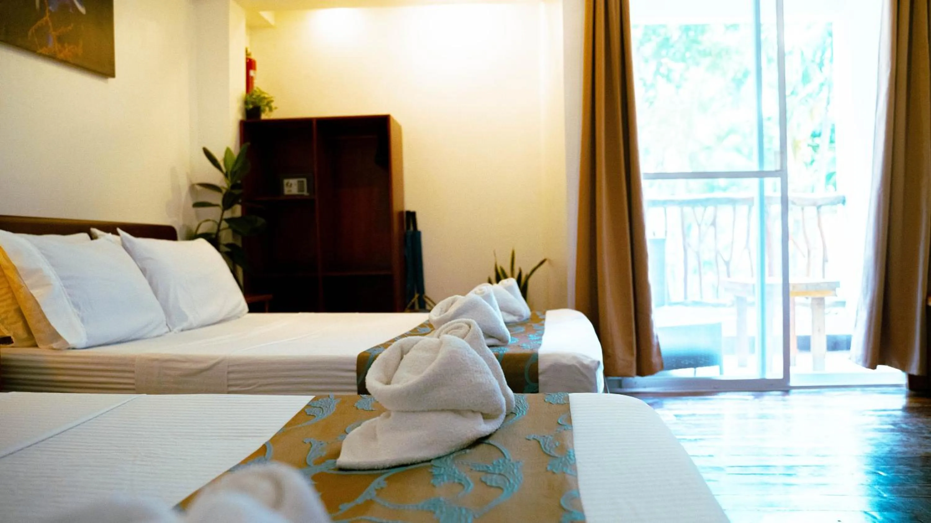 Bed in DiveGurus Boracay Beach Resort