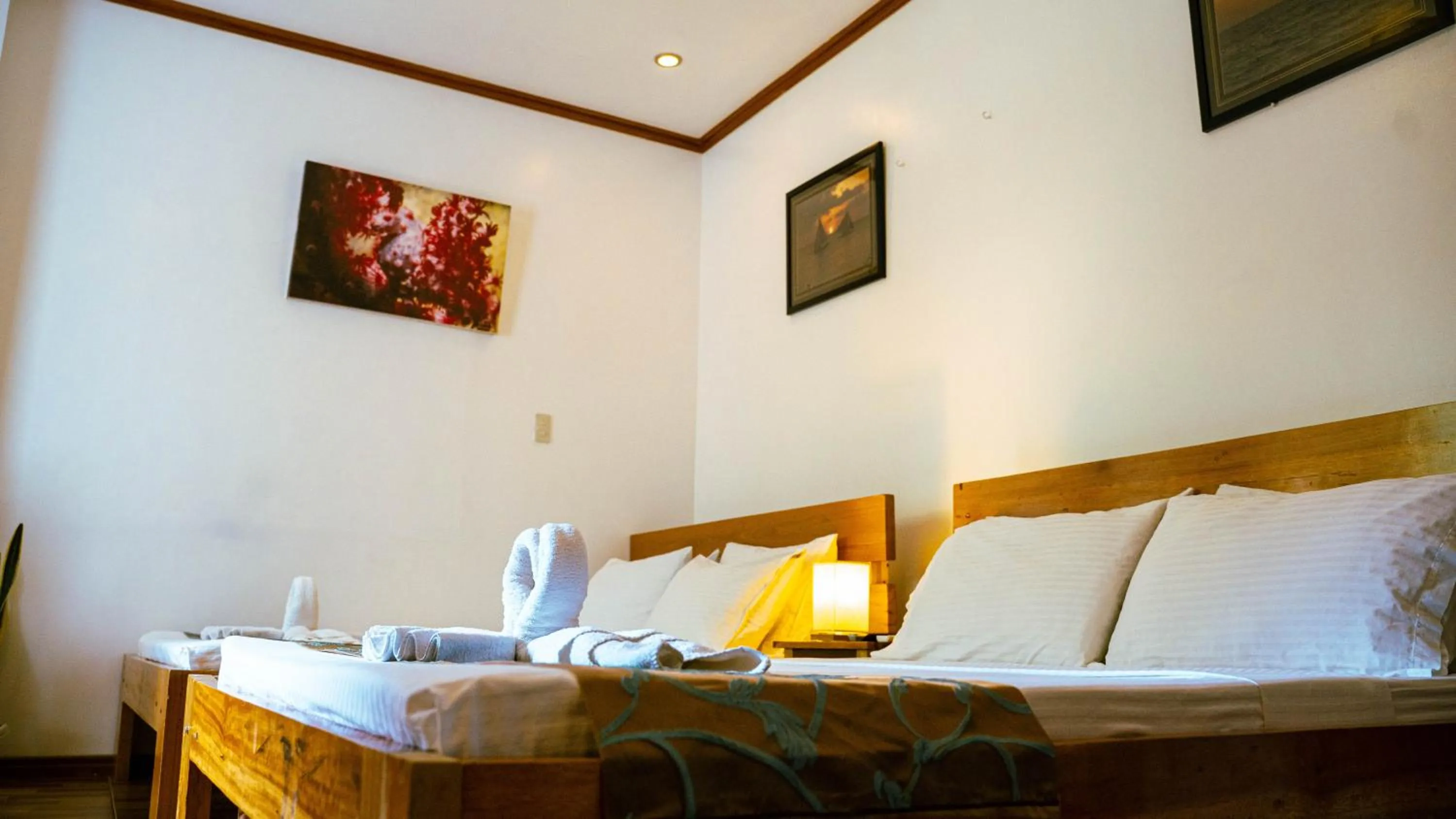 Bed in DiveGurus Boracay Beach Resort