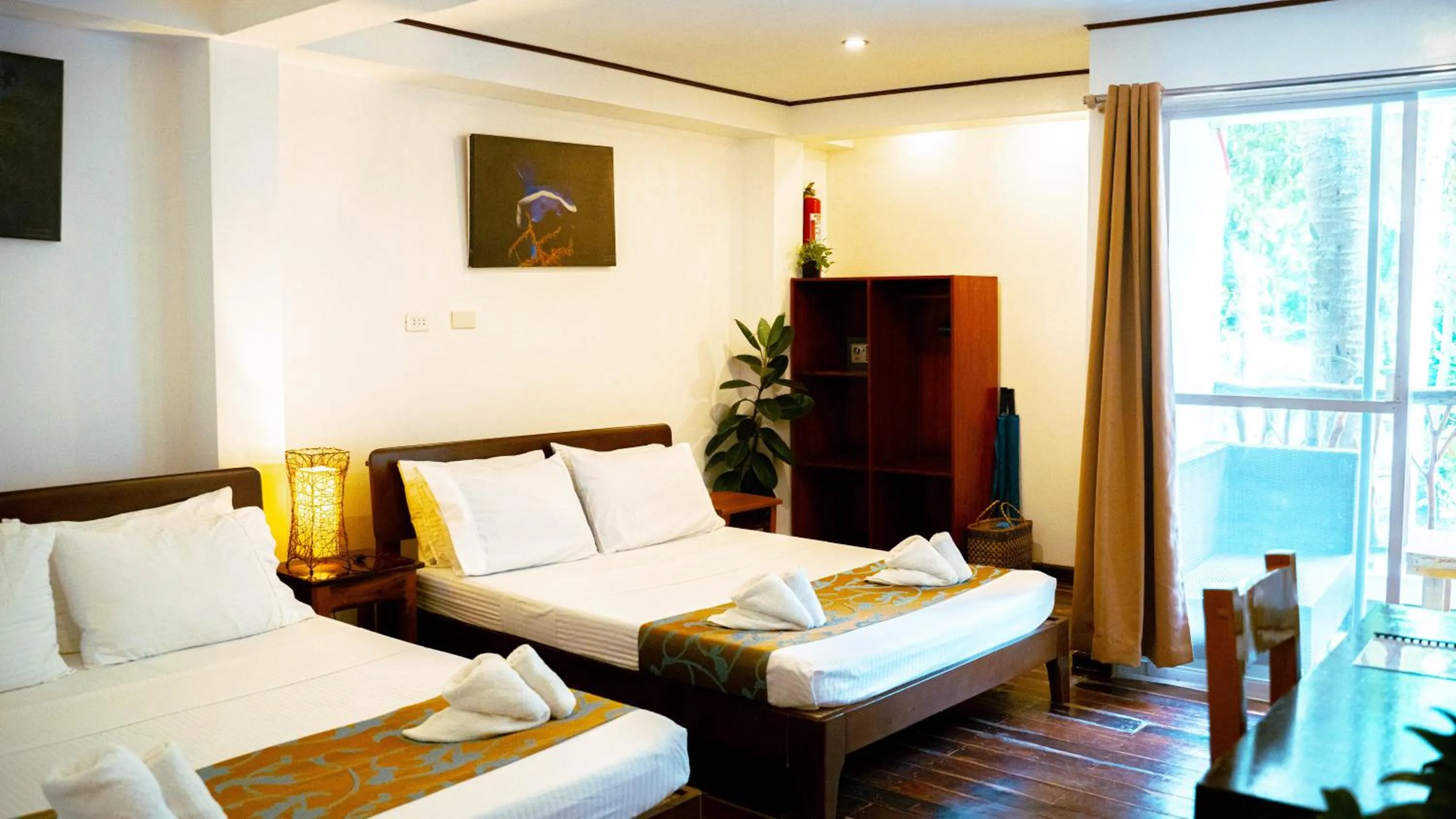 Bed in DiveGurus Boracay Beach Resort