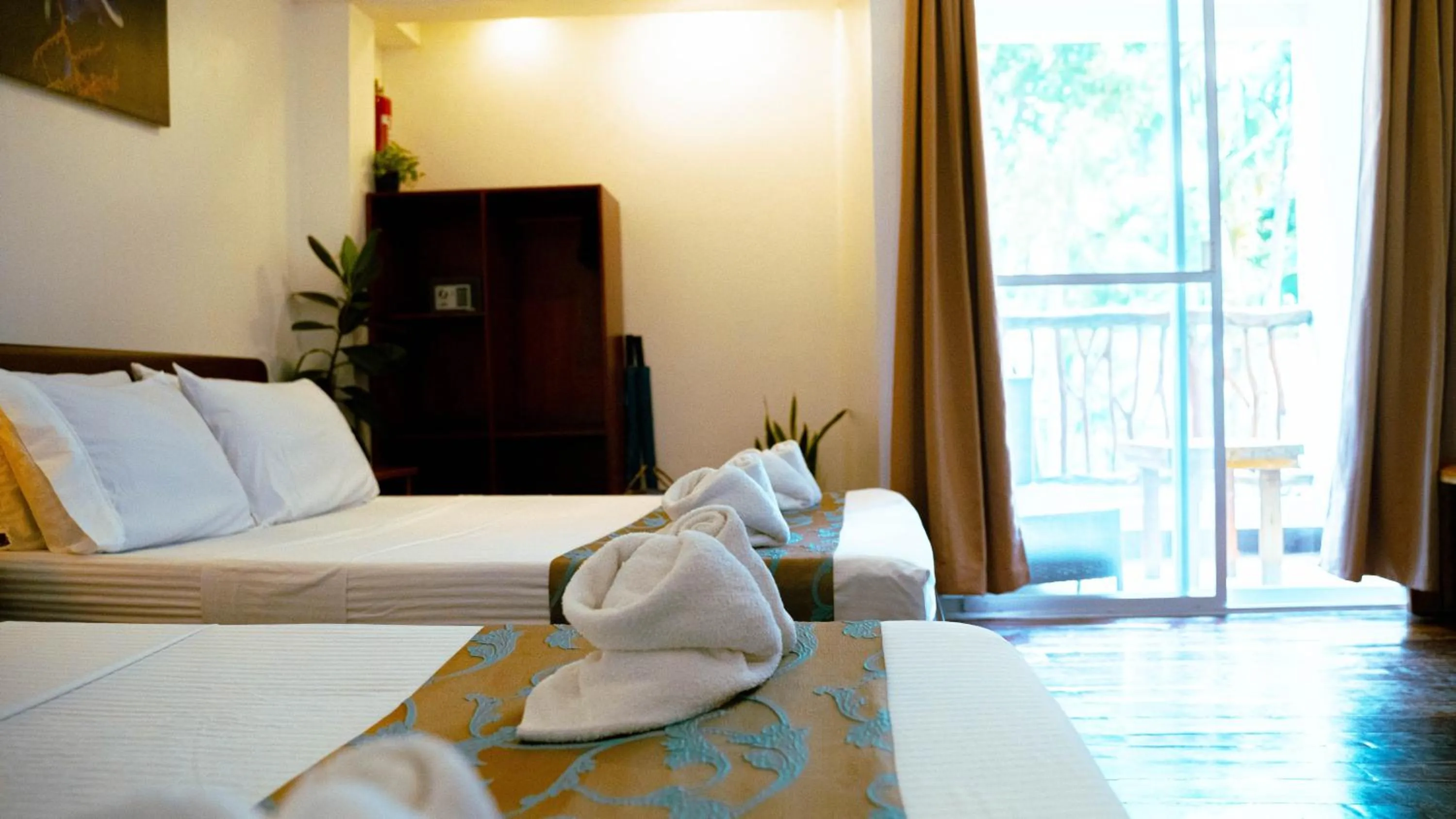 Bed in DiveGurus Boracay Beach Resort