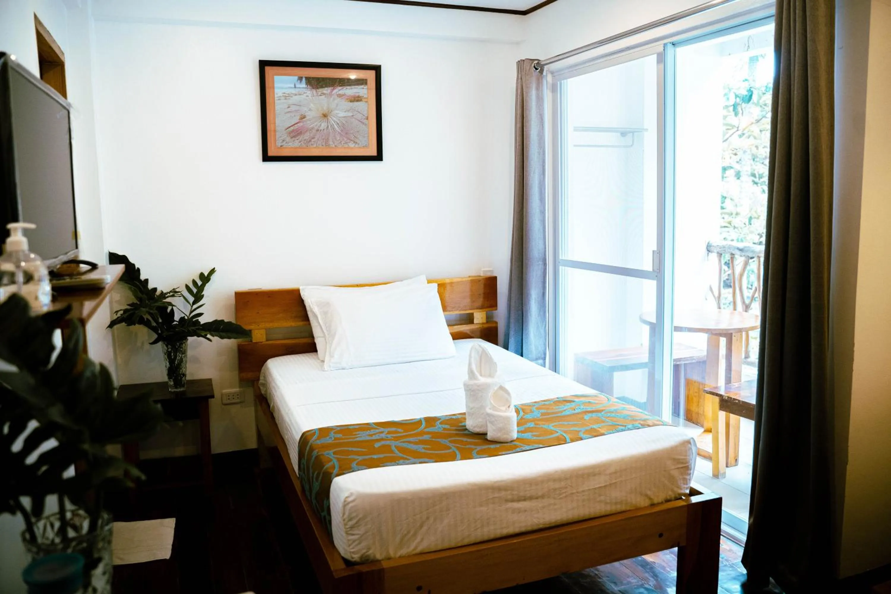 Bed in DiveGurus Boracay Beach Resort