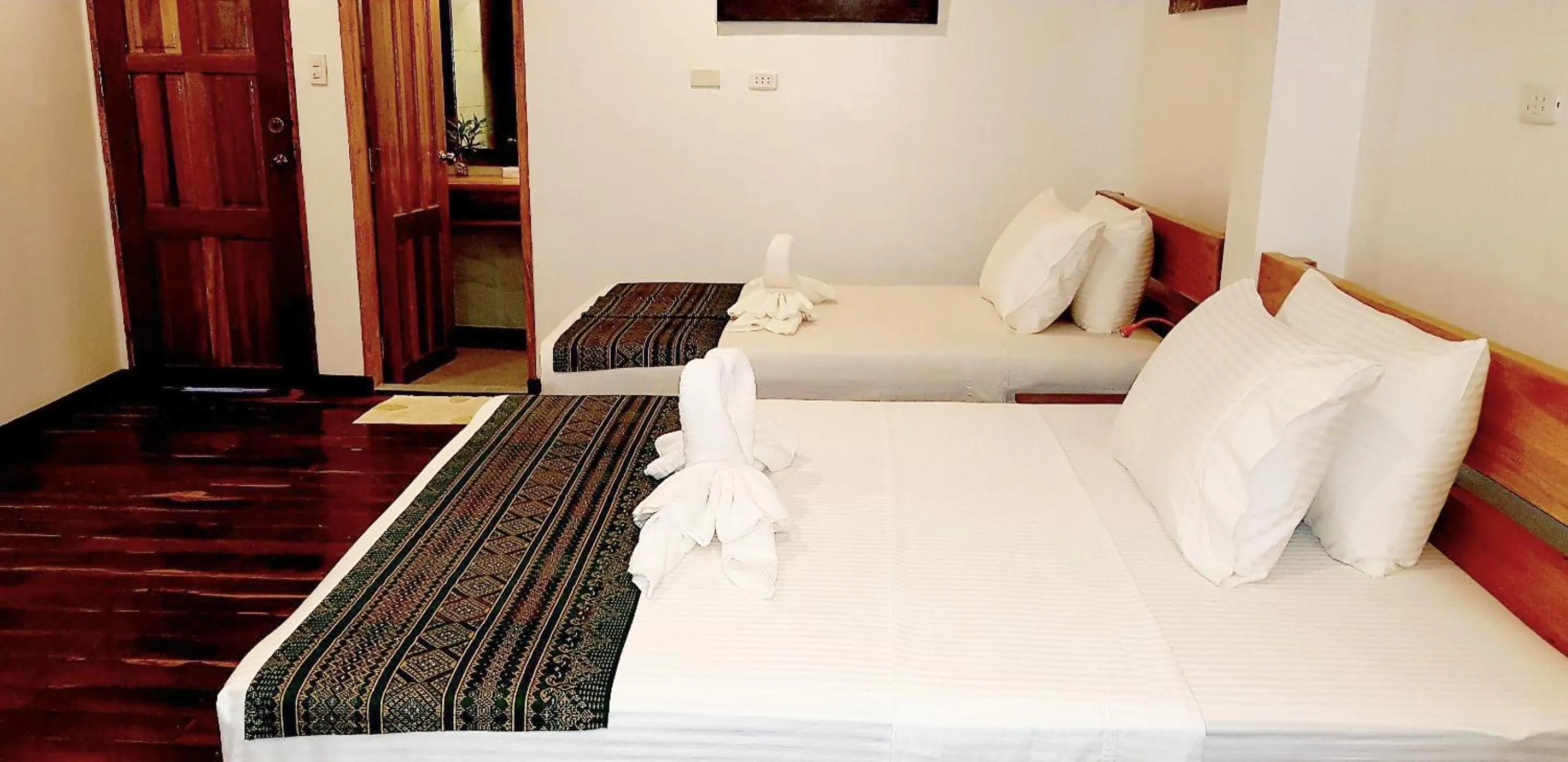 Bed in DiveGurus Boracay Beach Resort