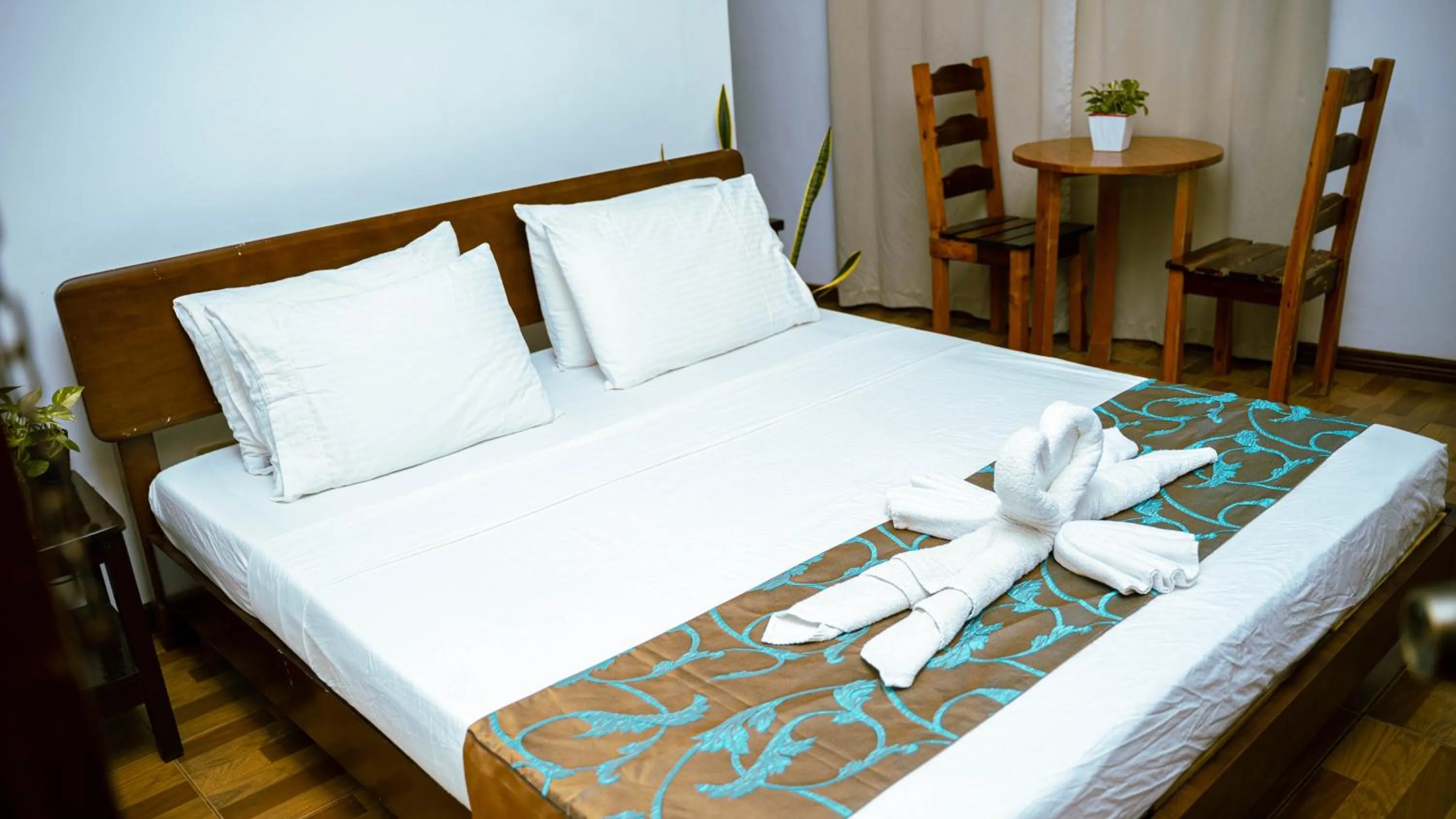 Bed in DiveGurus Boracay Beach Resort