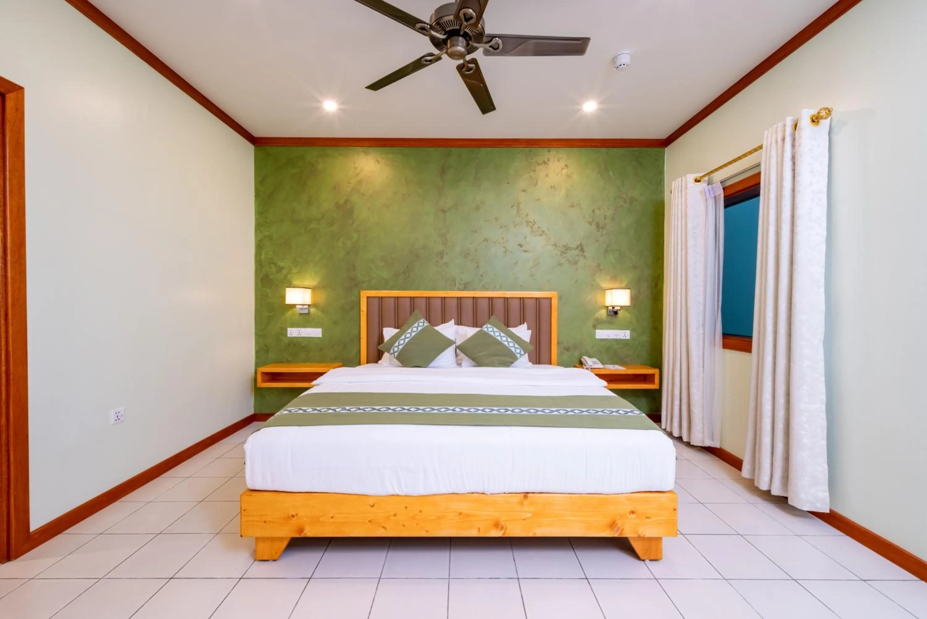 Bed in Fihalhohi Maldives