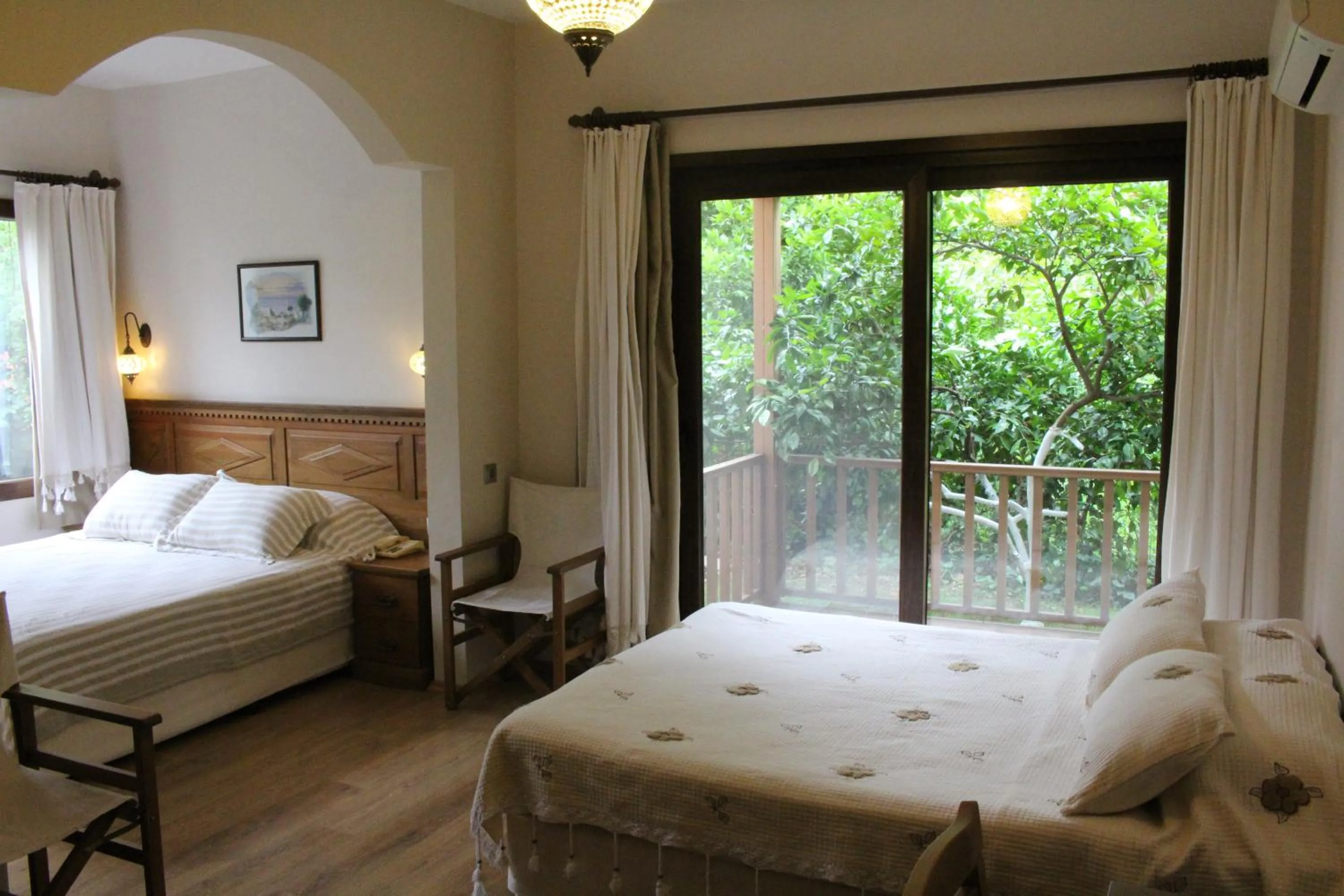 Living room, Bed in Nirvana Hotel