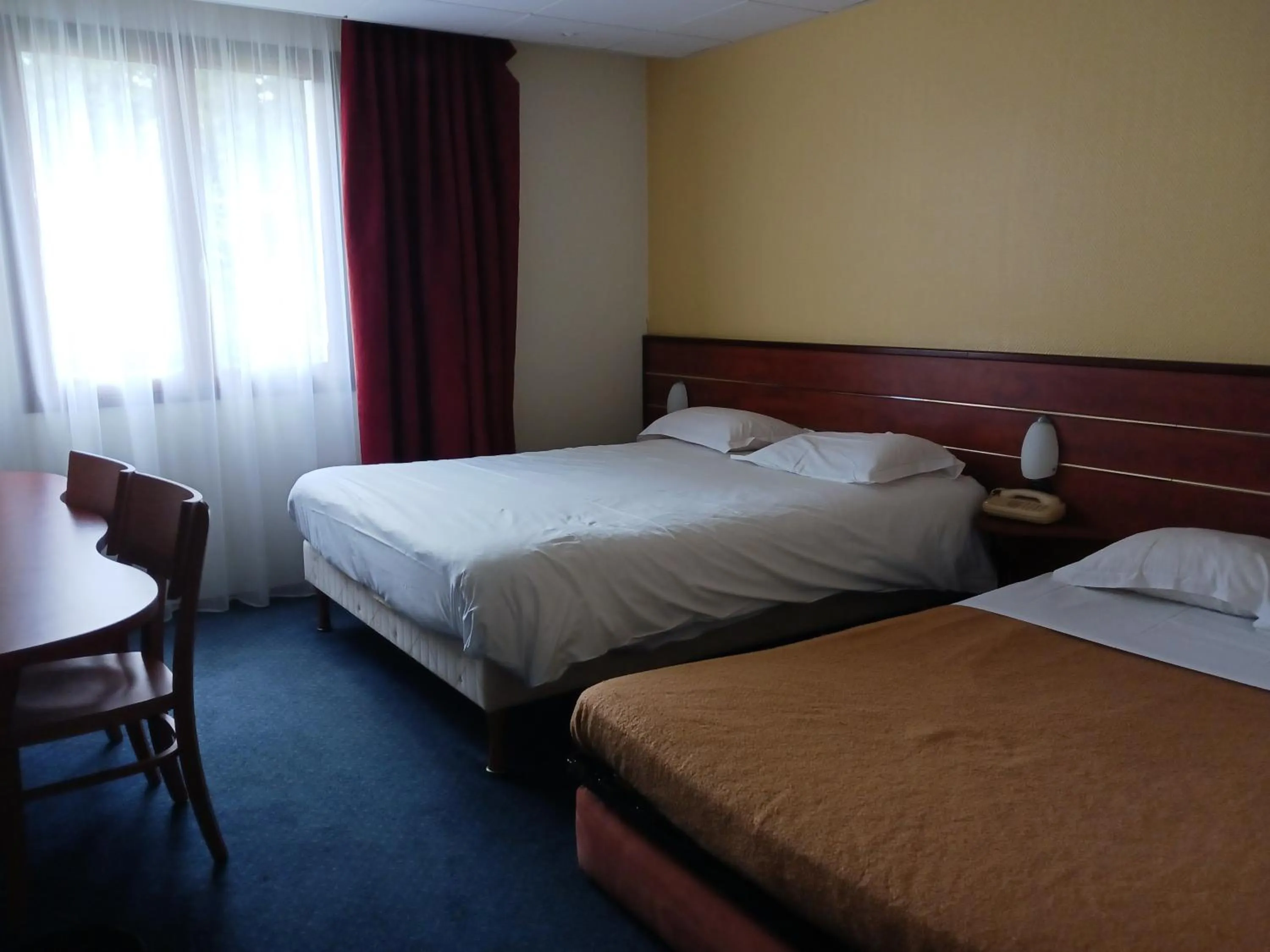 Photo of the whole room, Bed in Brit Hotel Nantes Vigneux - L'Atlantel