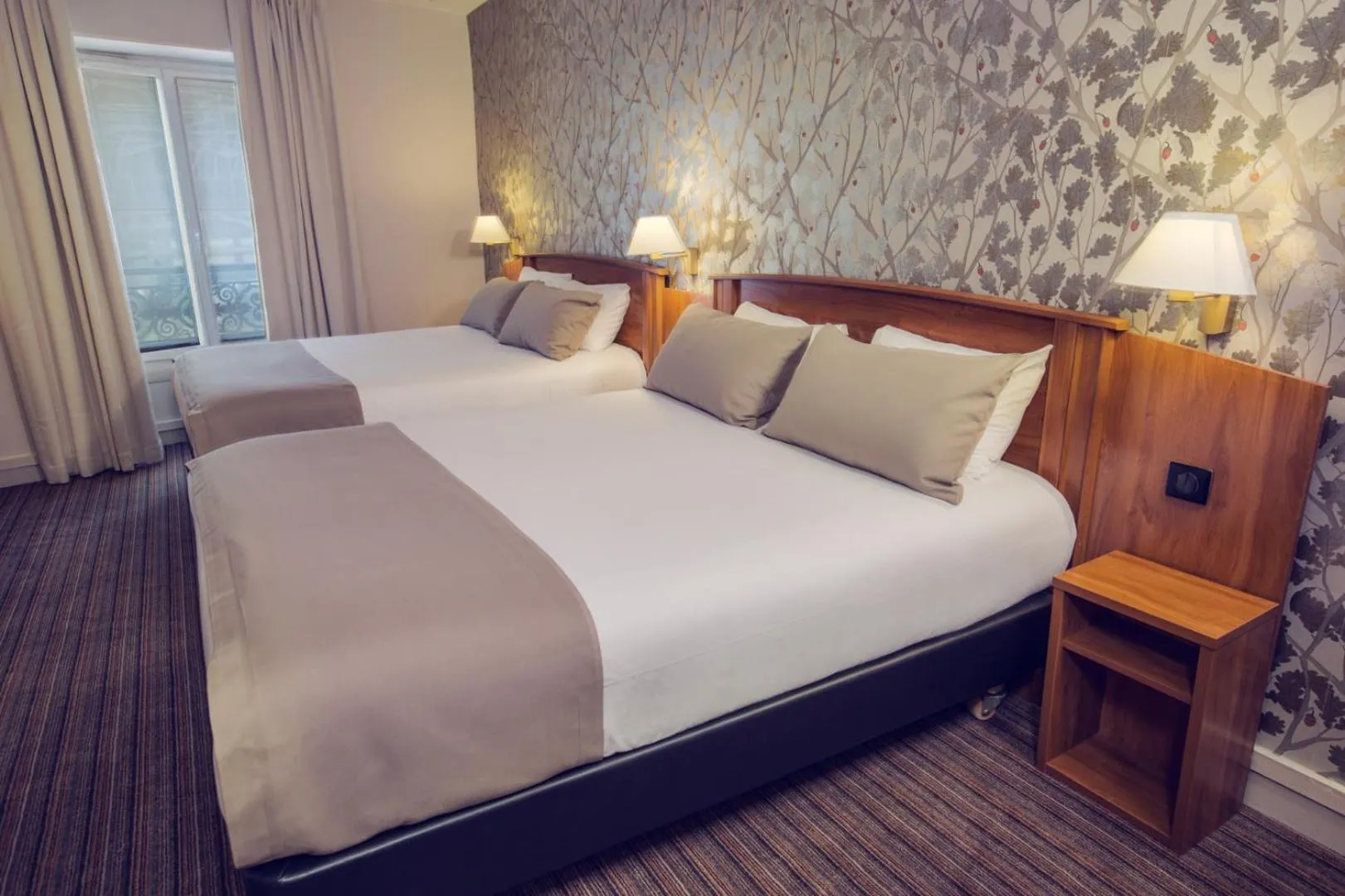 Bed in Timhotel Le Louvre