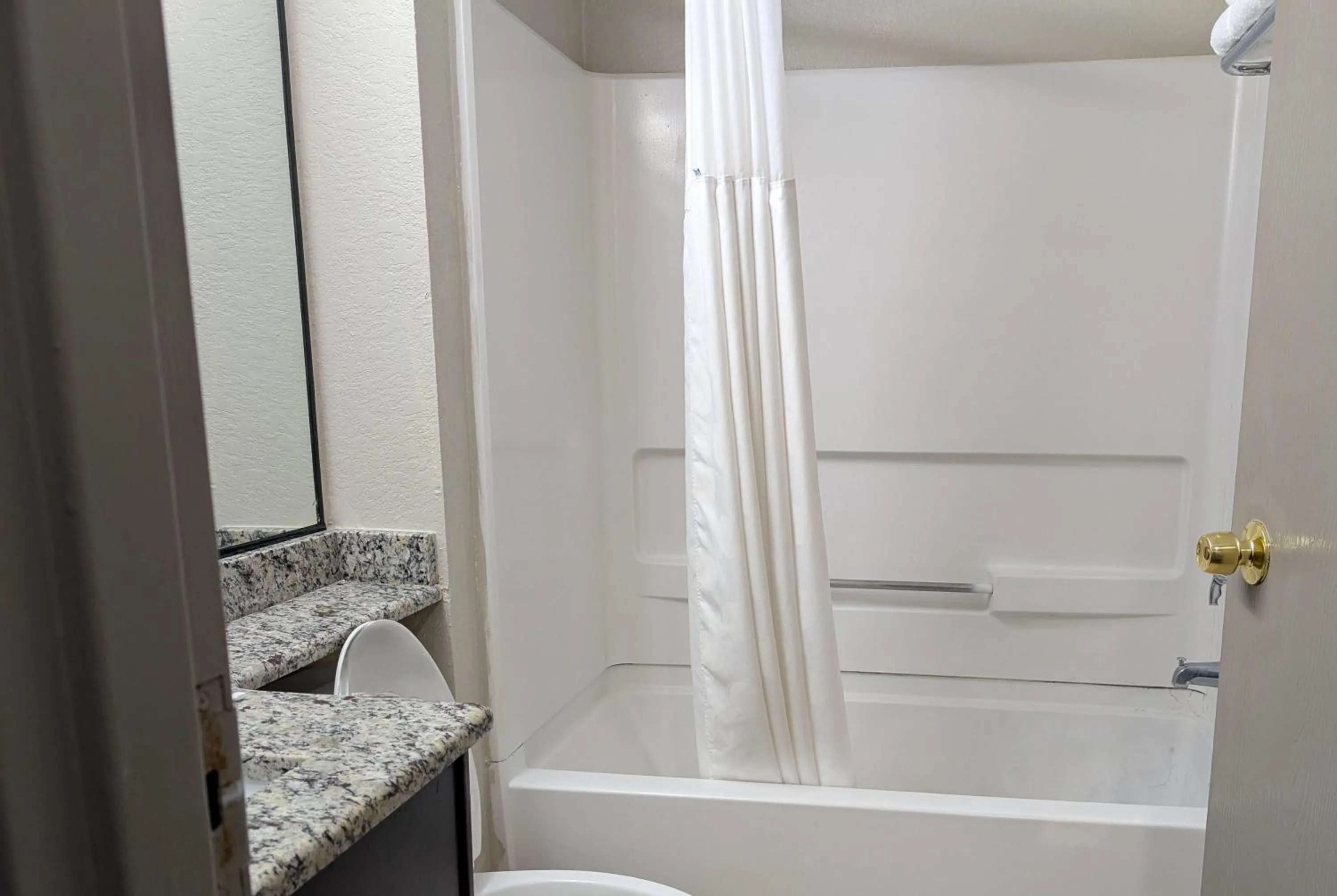 Bathroom in Days Inn & Suites by Wyndham Tampa/Raymond James Stadium