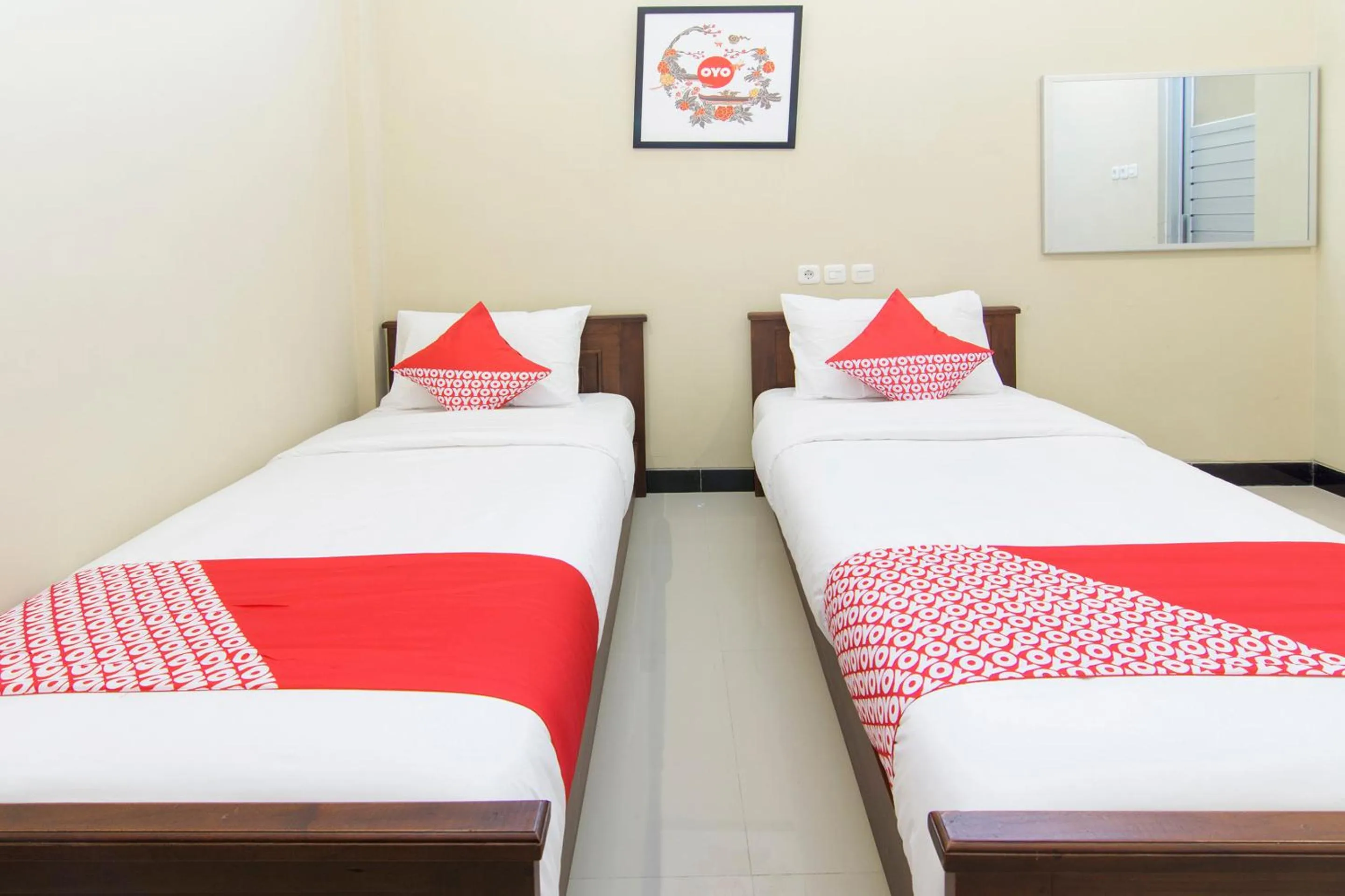Bedroom in SUPER OYO 890 Dewi Fortuna Guest House