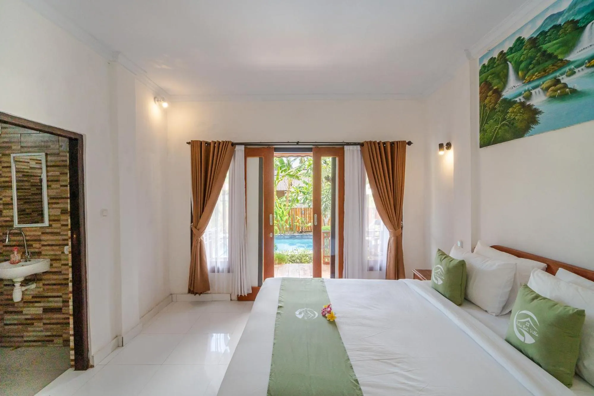 Bed in Putra Bali Villa by Bukit Vista