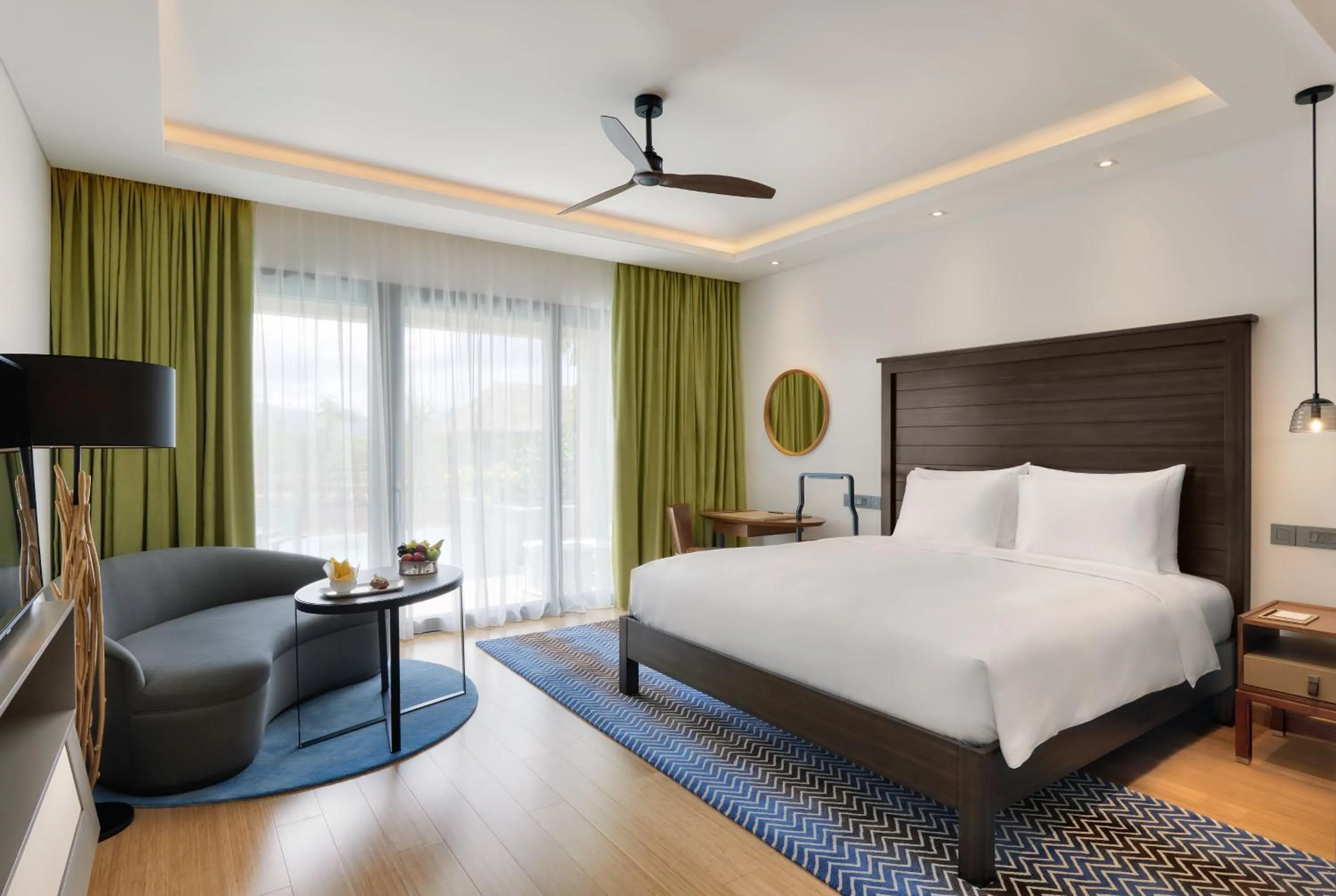 Seating area, Bed in InterContinental Dominica Cabrits Resort & Spa by IHG