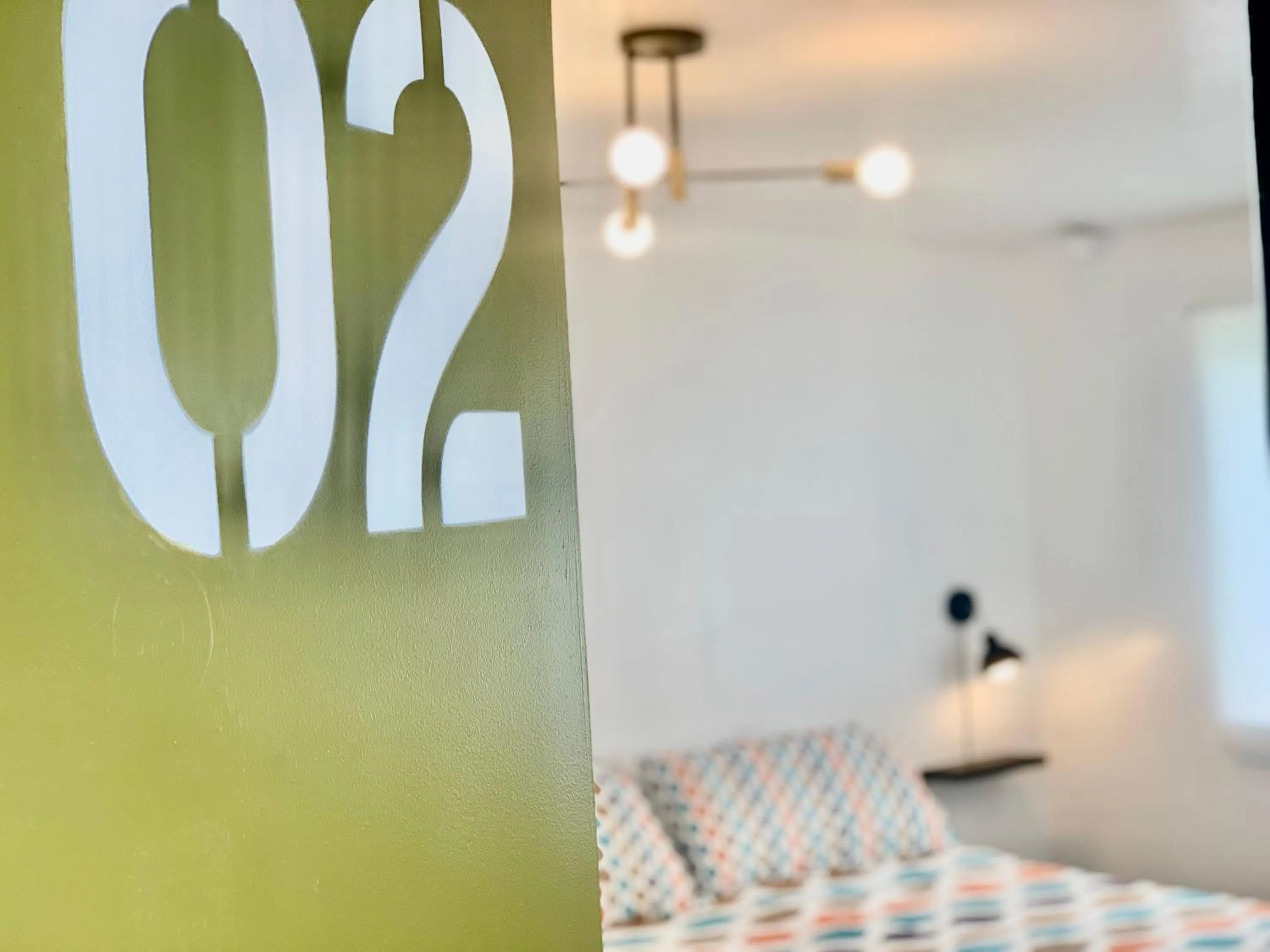 Bed in Dragonfly Motor Lodge