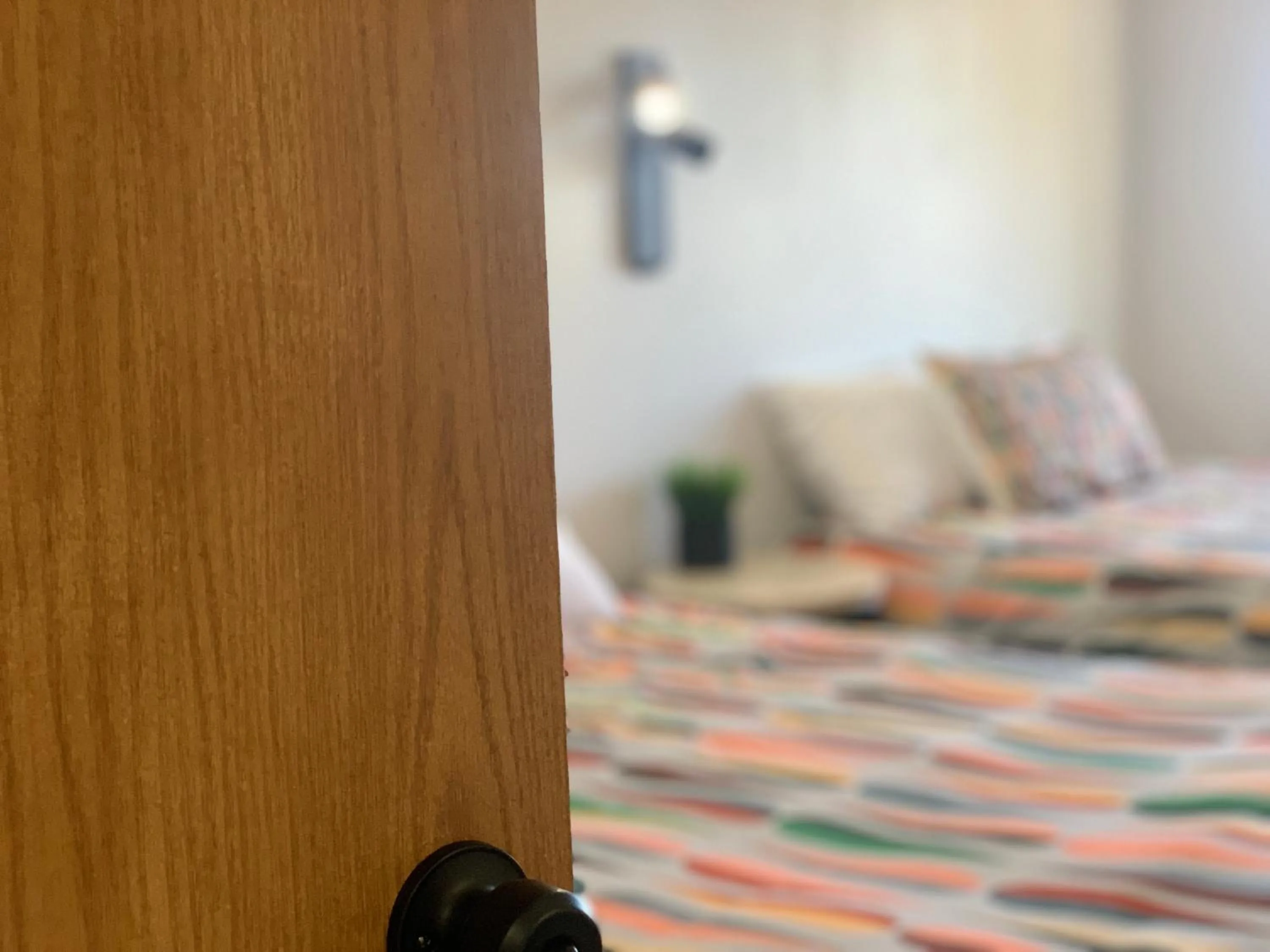 Bed in Dragonfly Motor Lodge