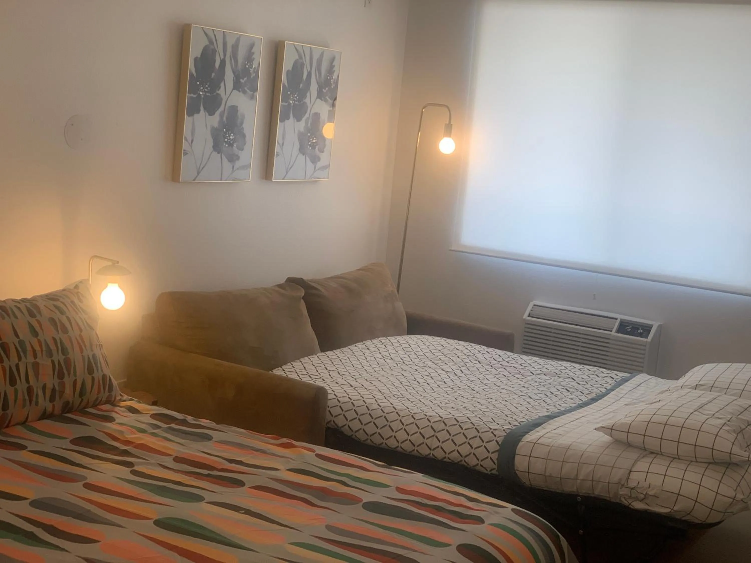 Bed in Dragonfly Motor Lodge