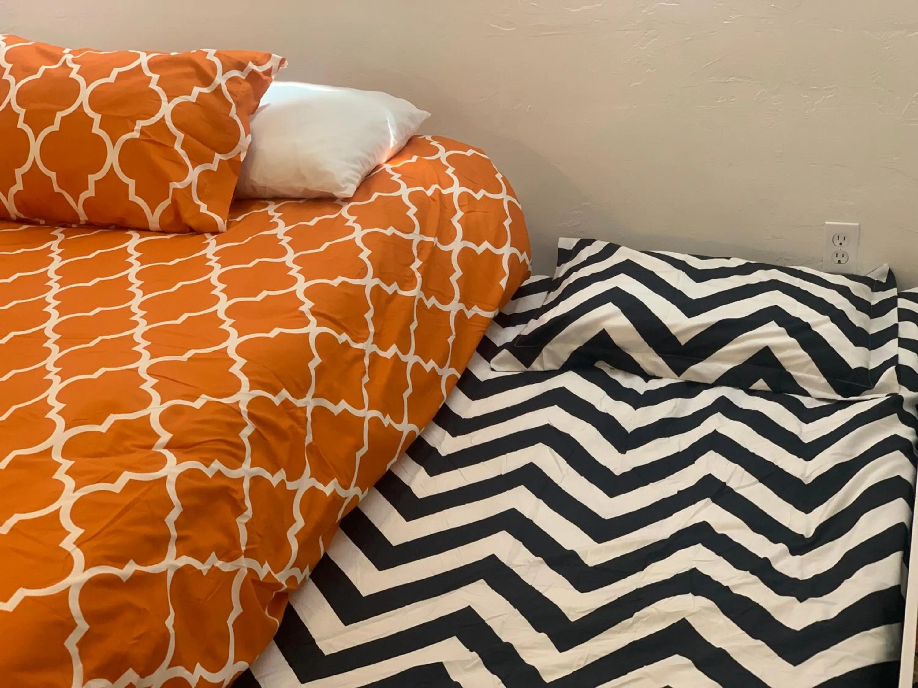 Bed in Dragonfly Motor Lodge