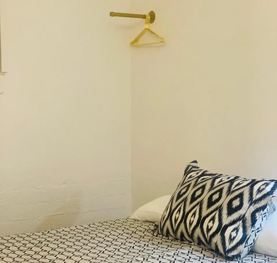 Bed in Dragonfly Motor Lodge