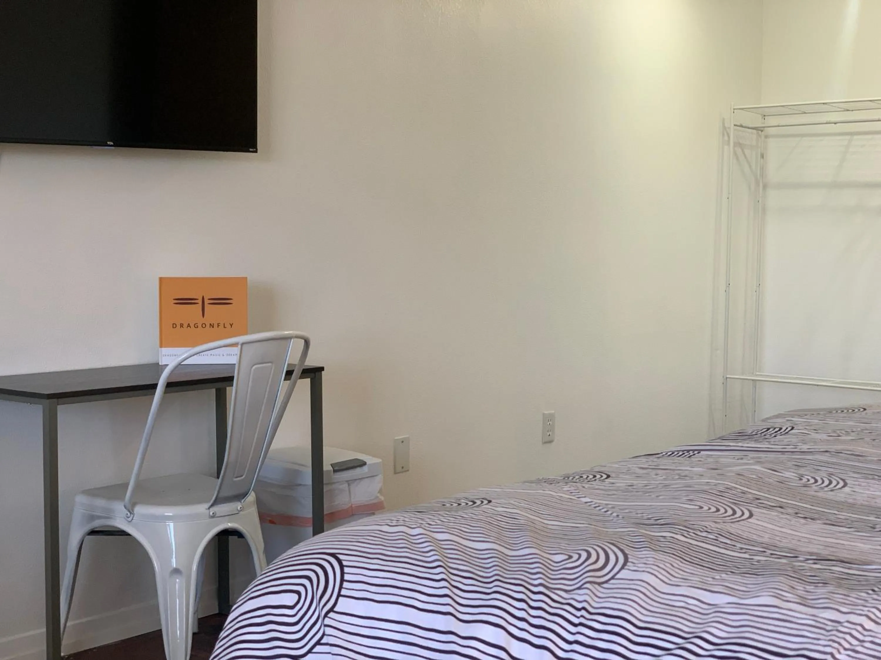 Bed in Dragonfly Motor Lodge