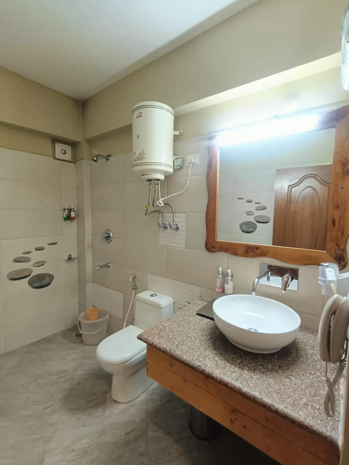 Bathroom in Regenta Inn by Riverside Manali