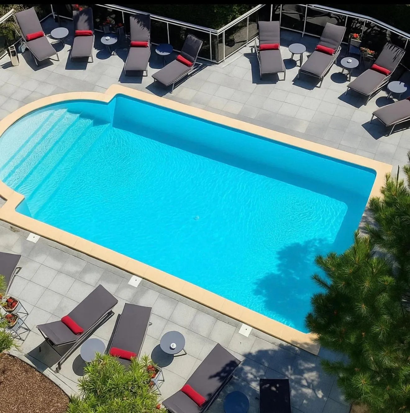 Swimming pool in Le M & Spa Bordeaux Aéroport by Hôtels & Préférence