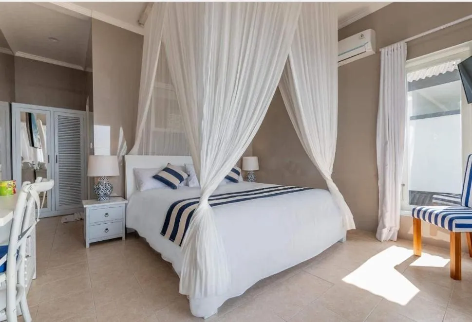 Bedroom in Bayu Cottages